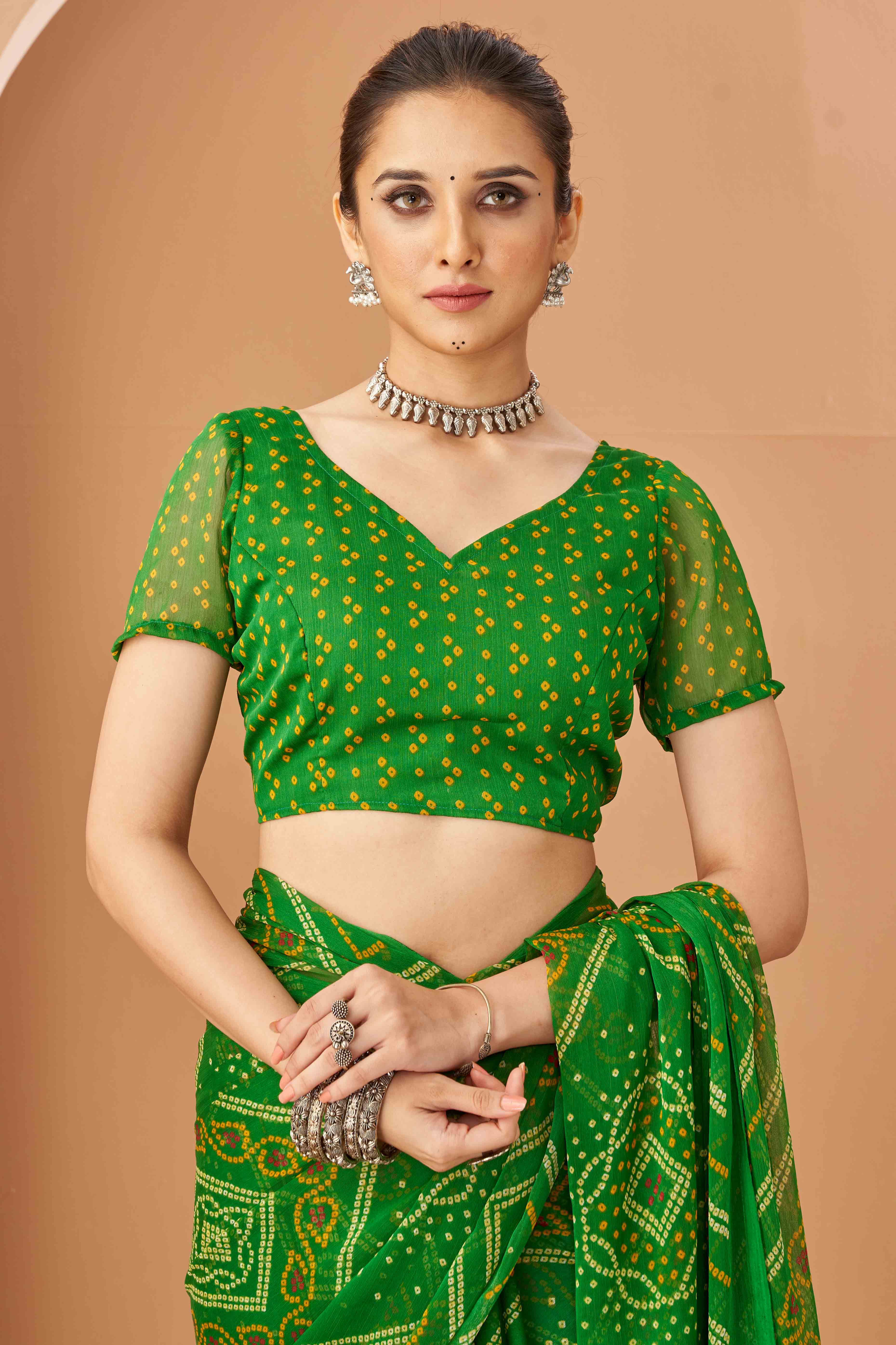 Green Bandhani Printed Chiffon Saree Accented With Intricate Lace Border Work