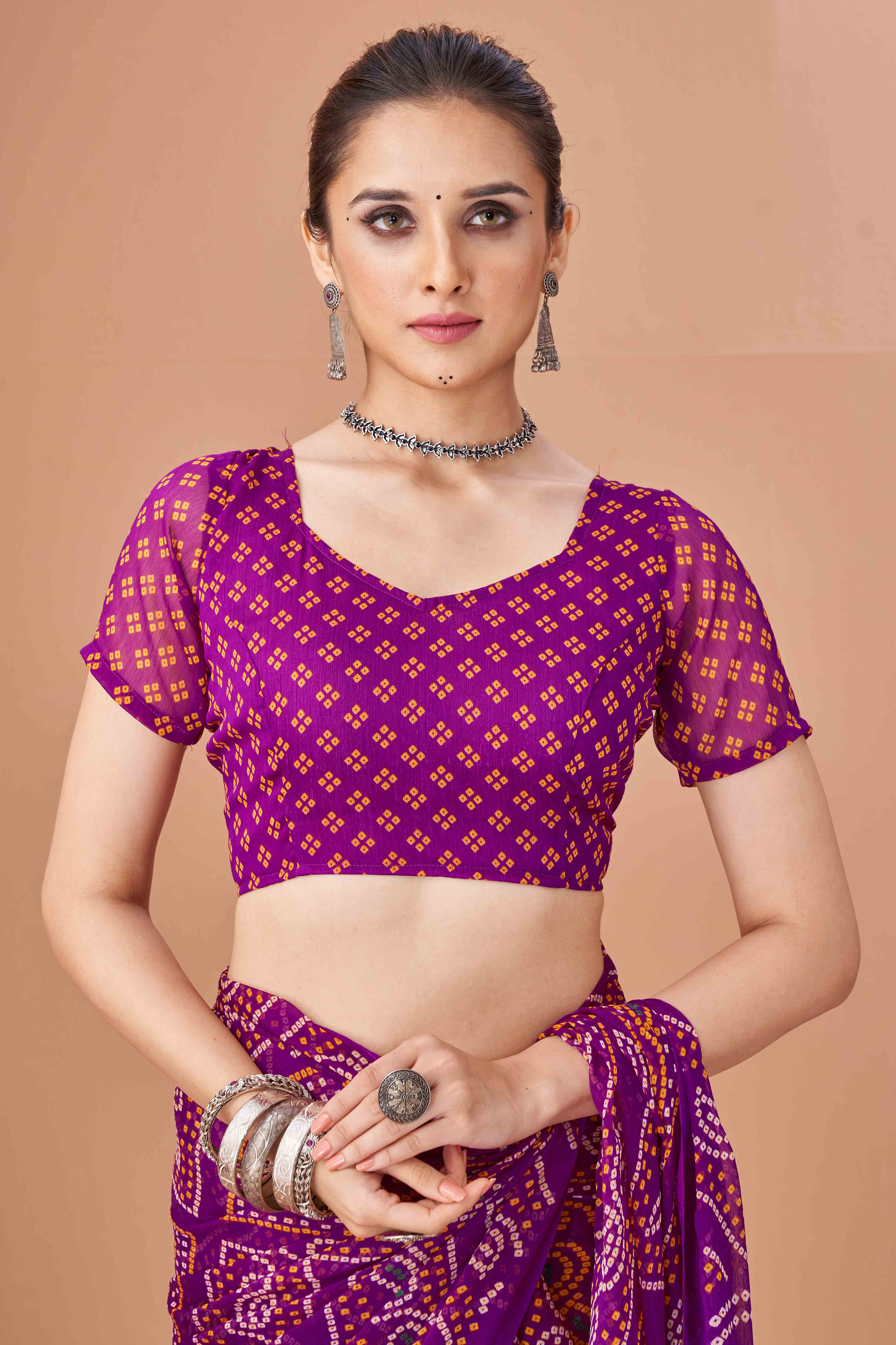 Purple Bandhani Printed Chiffon Saree Accented With Intricate Lace Border Work