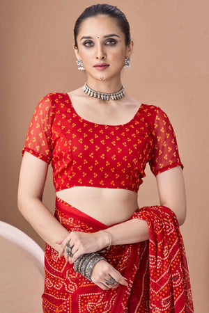 Red Bandhani Printed Chiffon Saree Accented With Intricate Lace Border Work