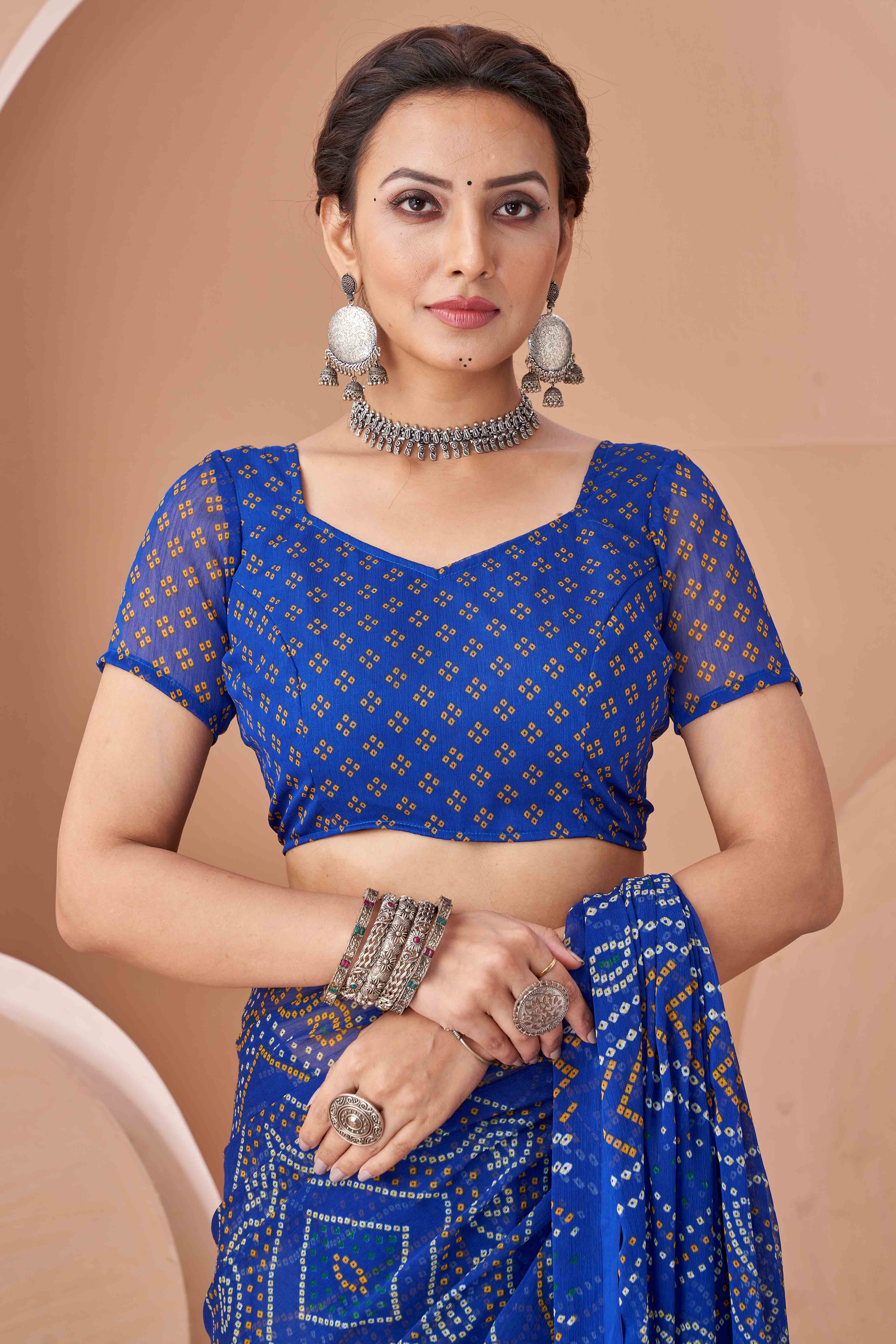 Blue Bandhani Printed Chiffon Saree Accented With Intricate Lace Border Work