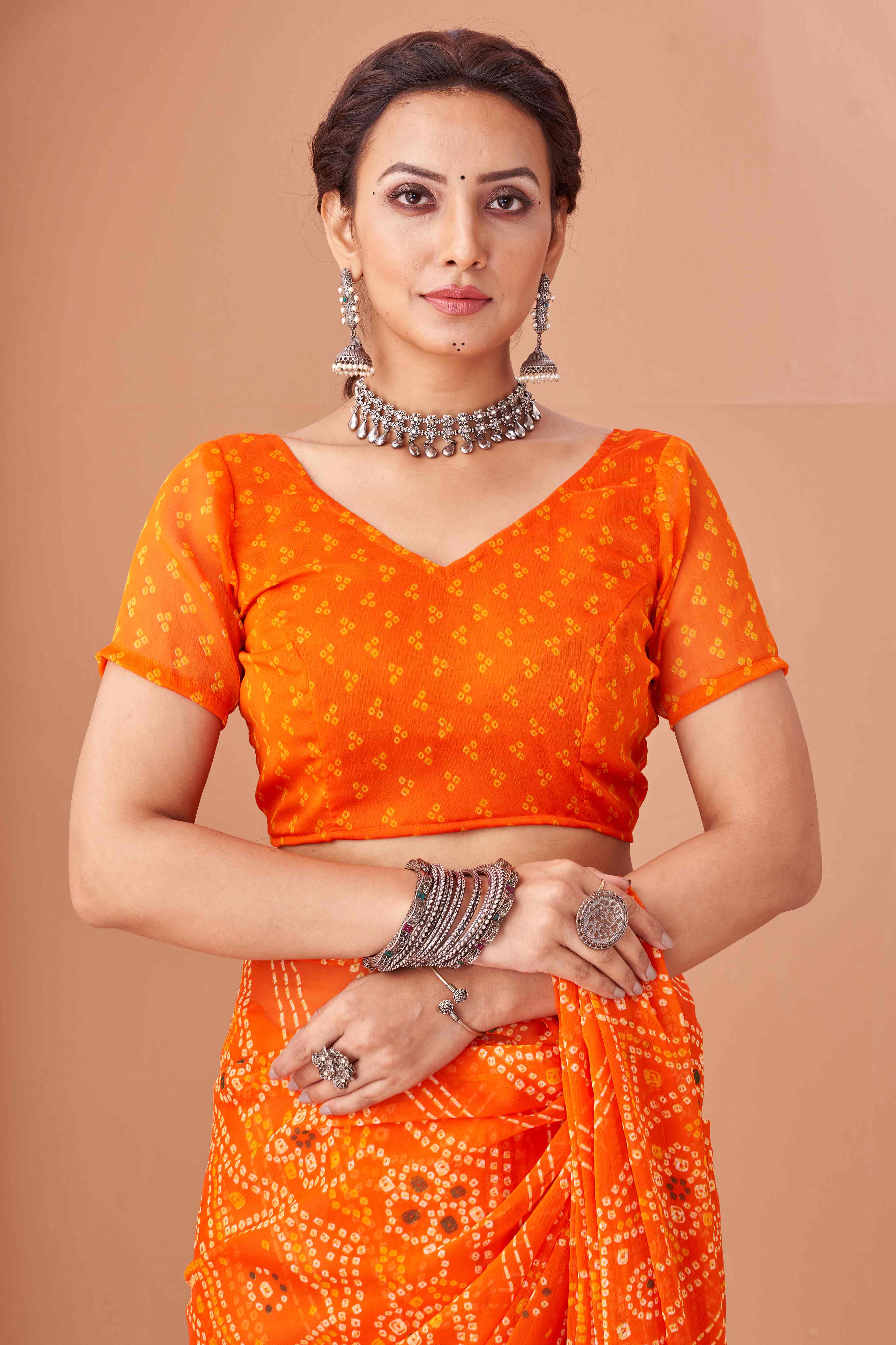 Orange Bandhani Printed Chiffon Saree Accented With Intricate Lace Border Work