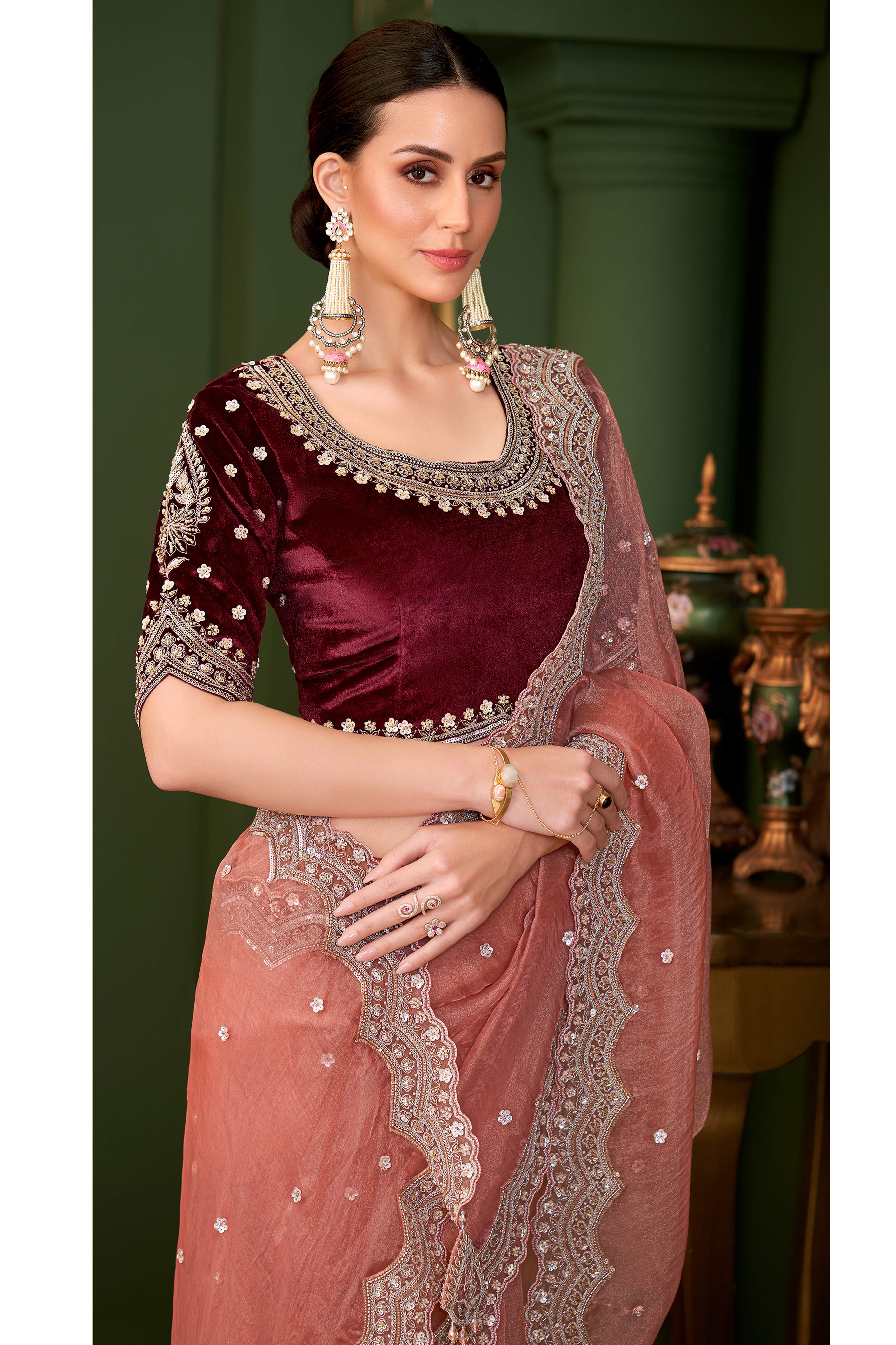 Charming Peach Georgette Saree Adorned With Floral Cording Sequins Embroidery & Cutwork Border