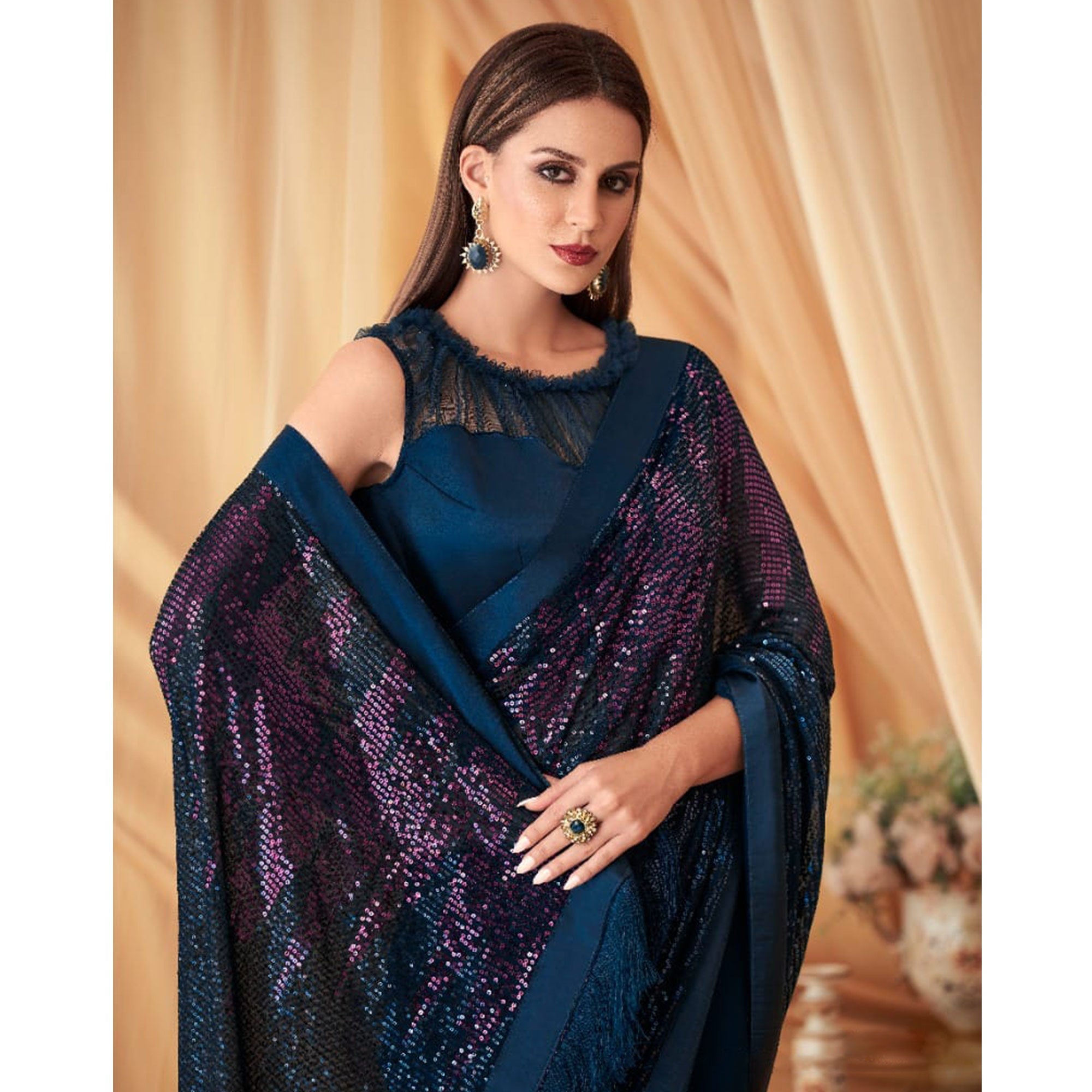 Blue Sequins Embroidered Georgette Saree With Tassels