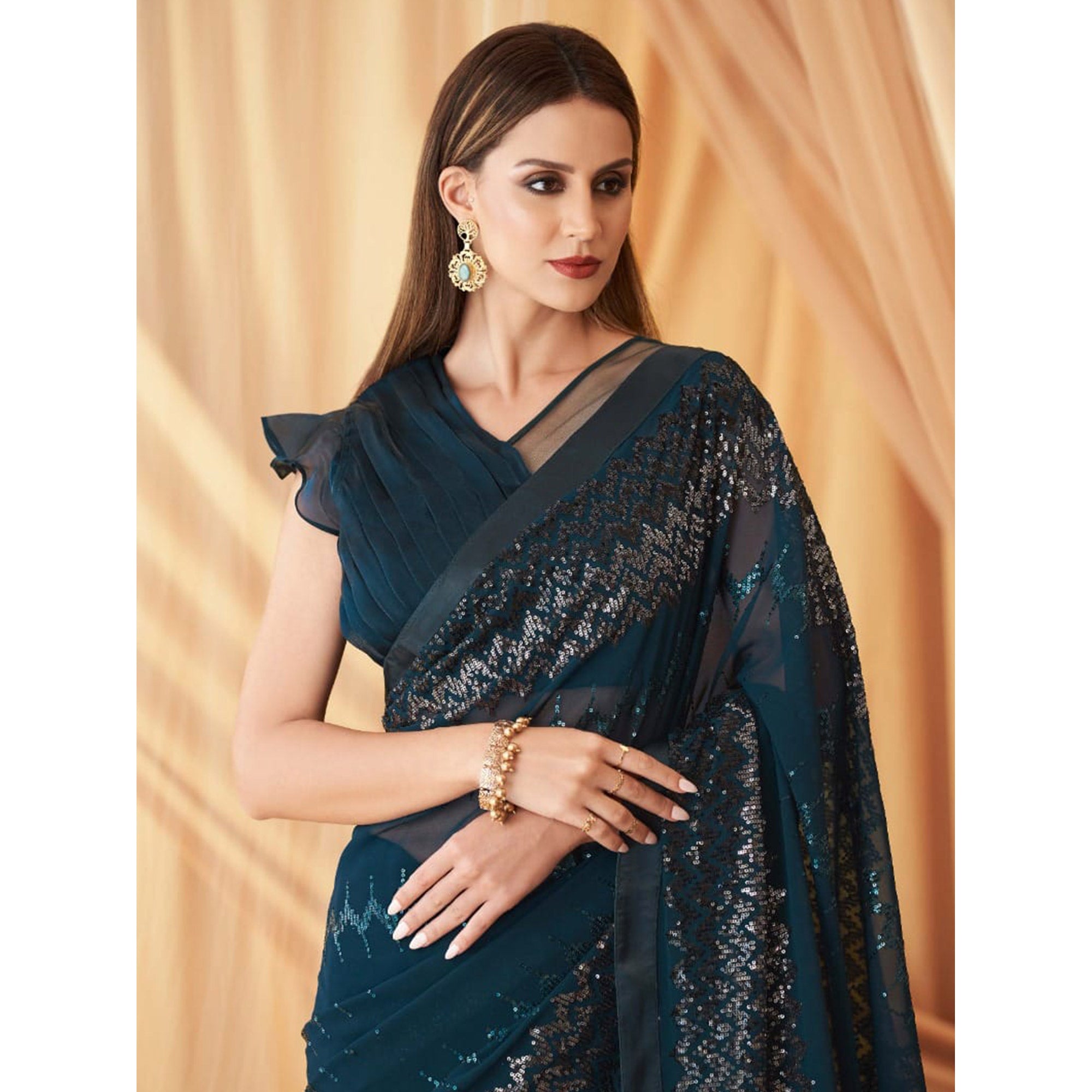 Teal Blue Sequins Embroidered Georgette Saree With Tassels