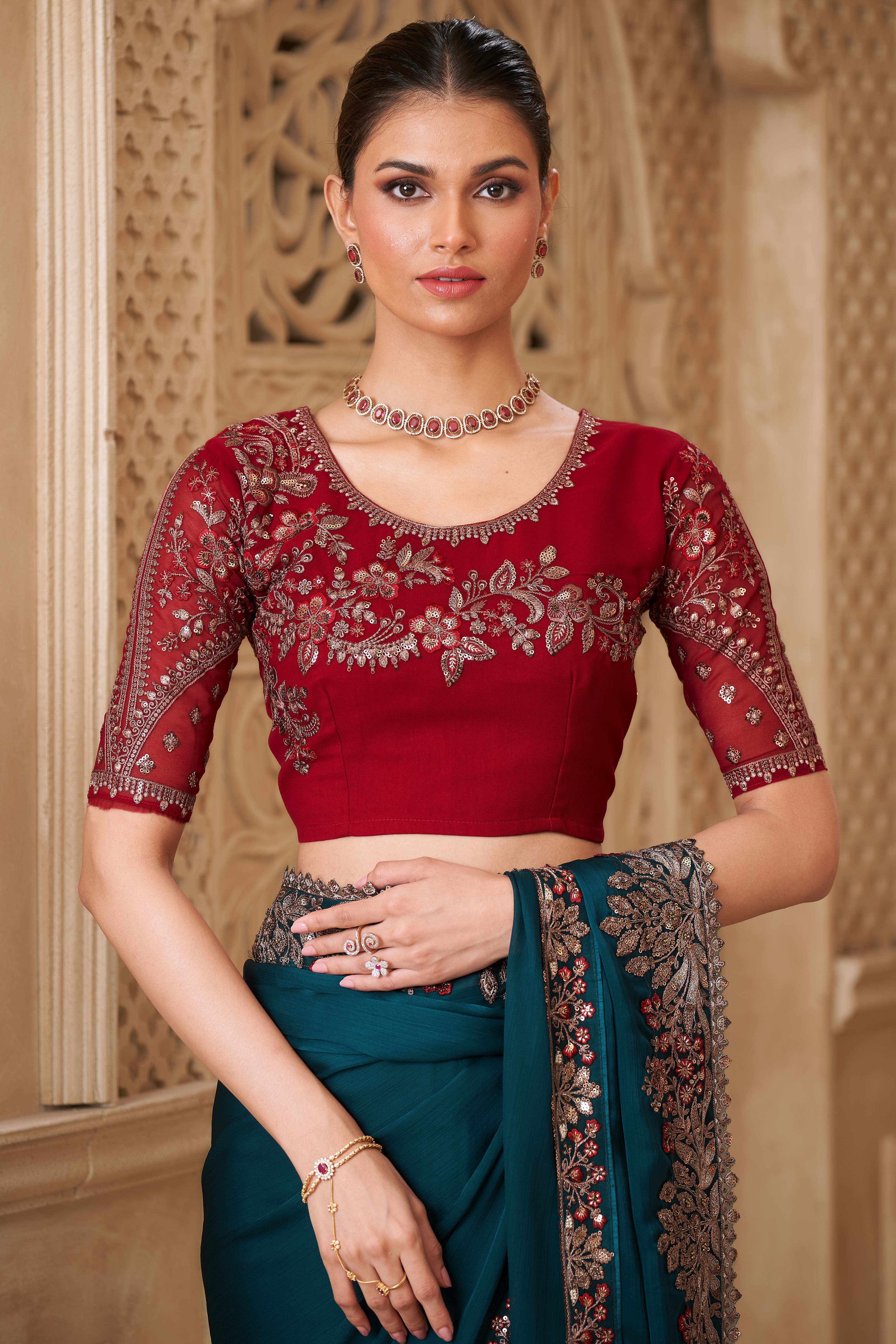 Shimmering Teal Georgette Saree with Graceful Thread Embellishment and Sequins