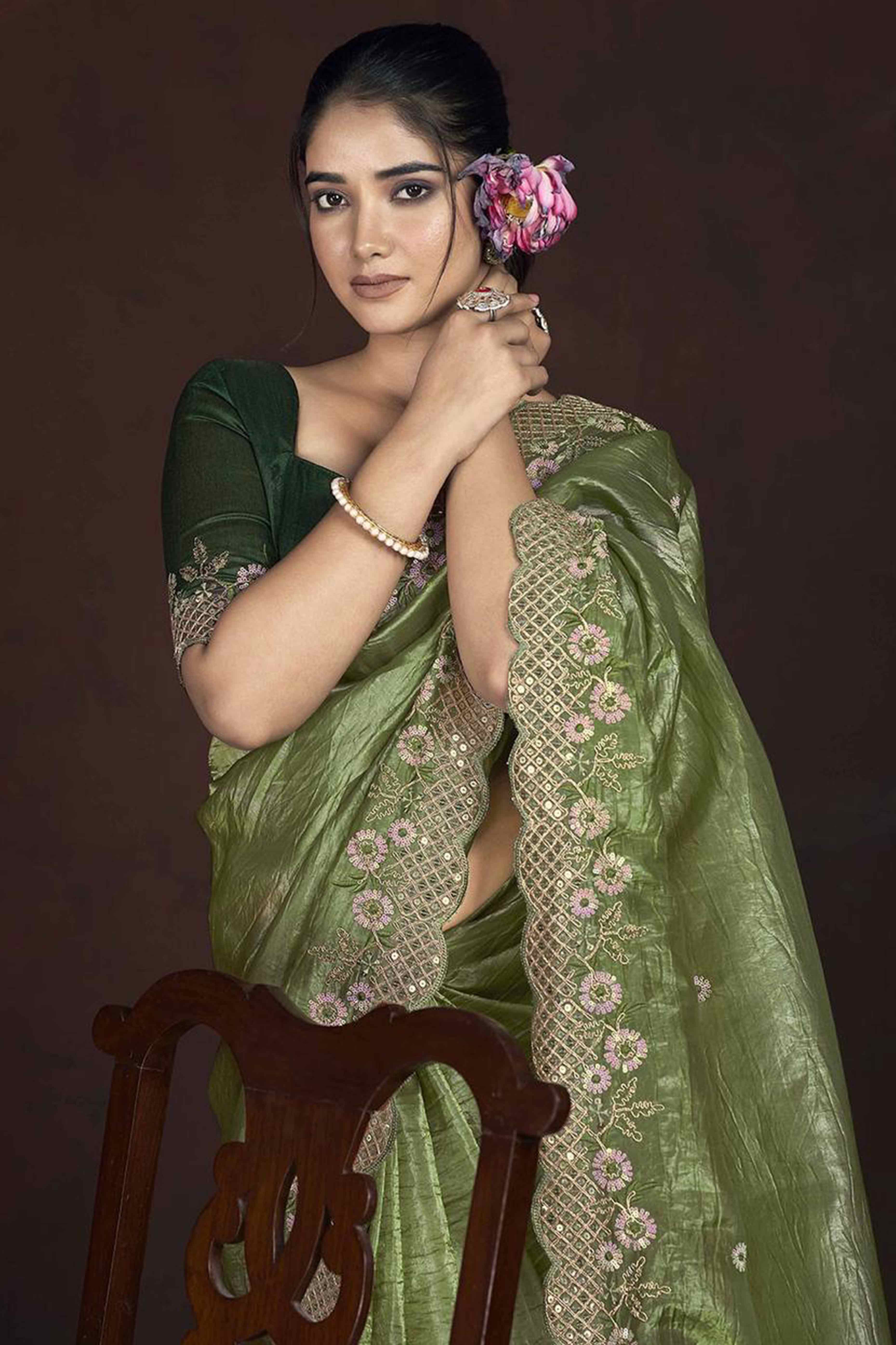 Green Organza Saree with Embroidery on the Edges for a Graceful Contemporary Look