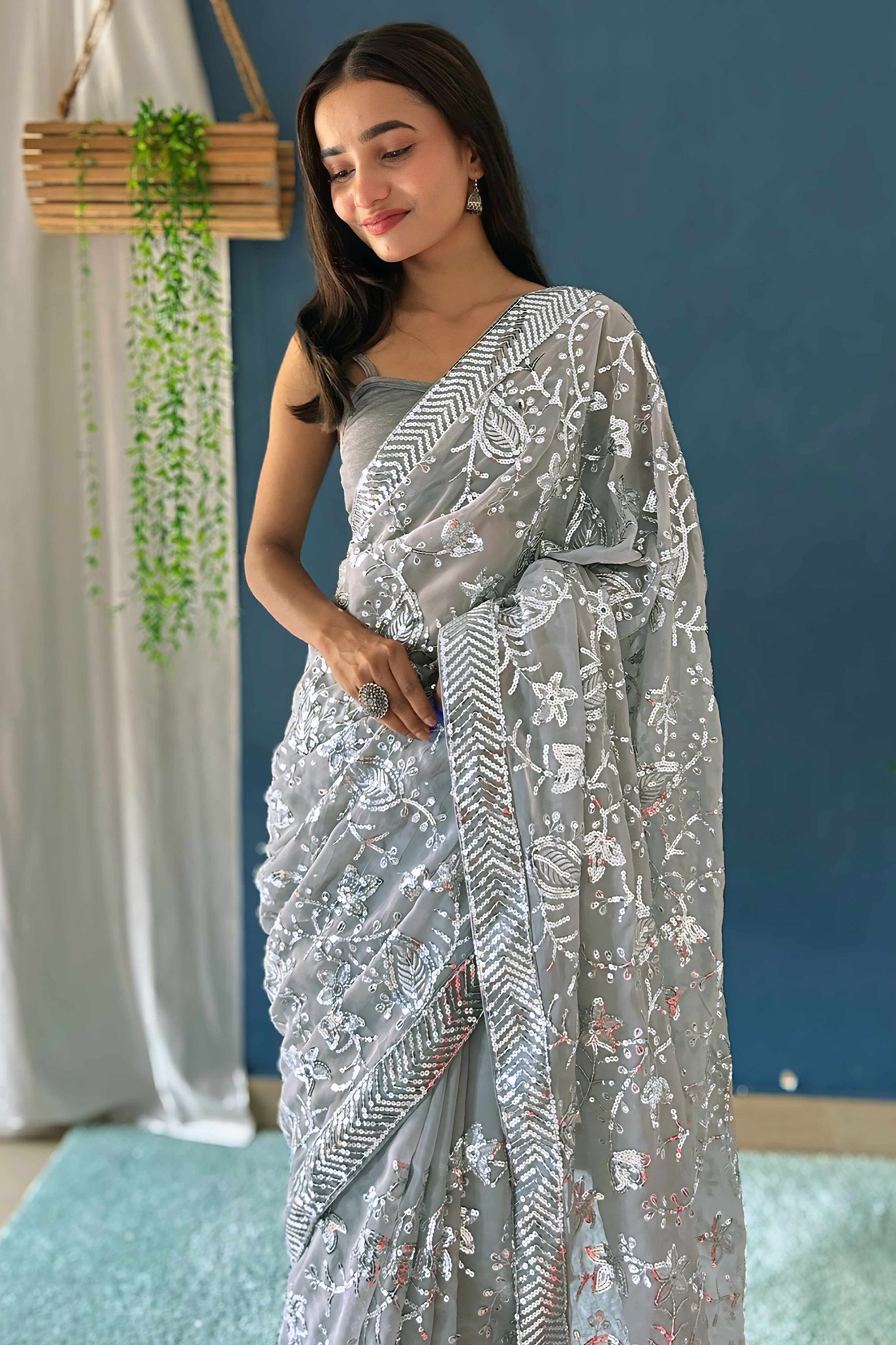Grey Sequins Embellished Georgette Saree with Delicate Embroidery and Sheer Grace