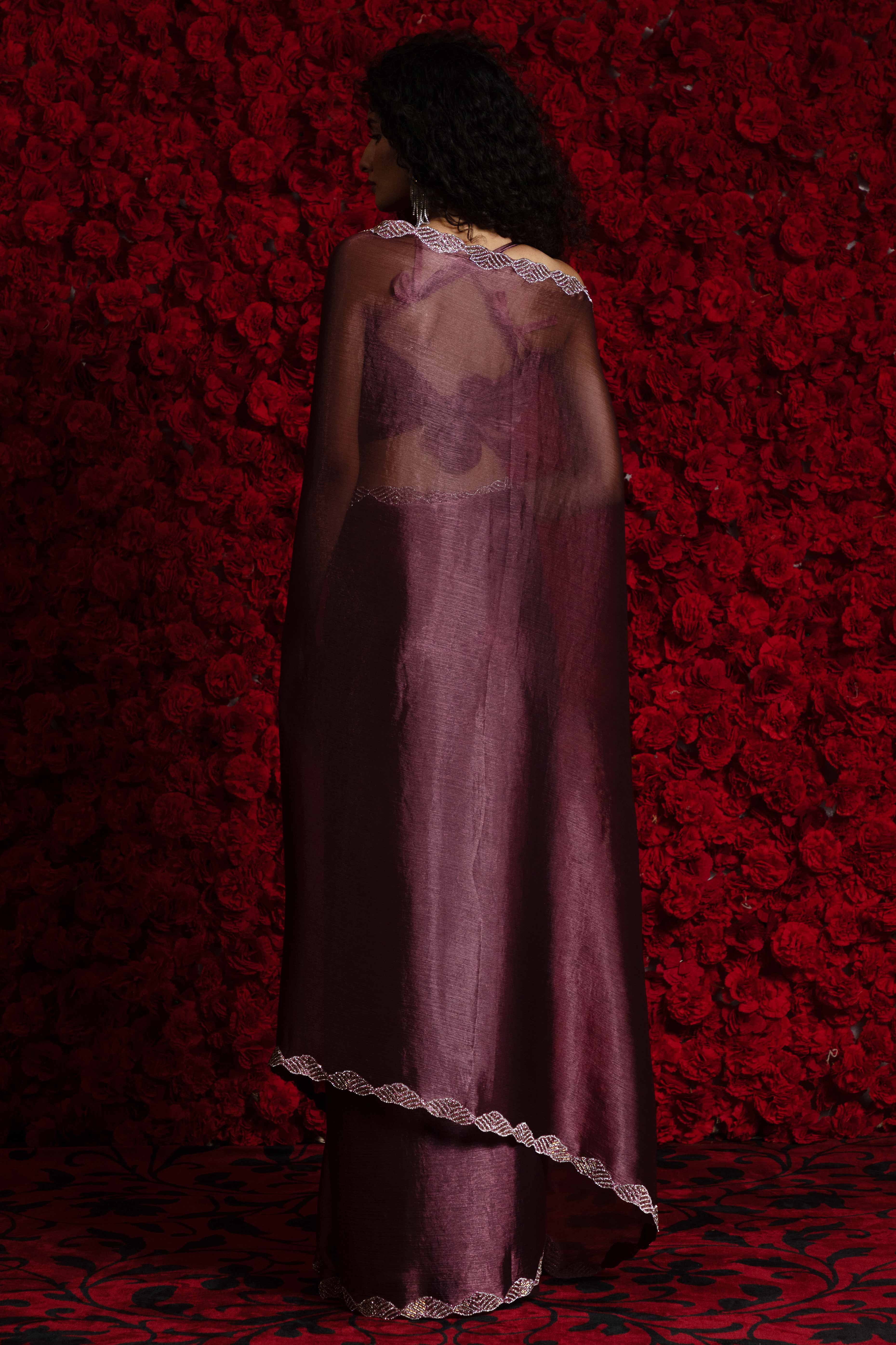 Burgundy Solid Tissue Chiffon Saree Accentuated With A Sparkling Zarkan Work Border