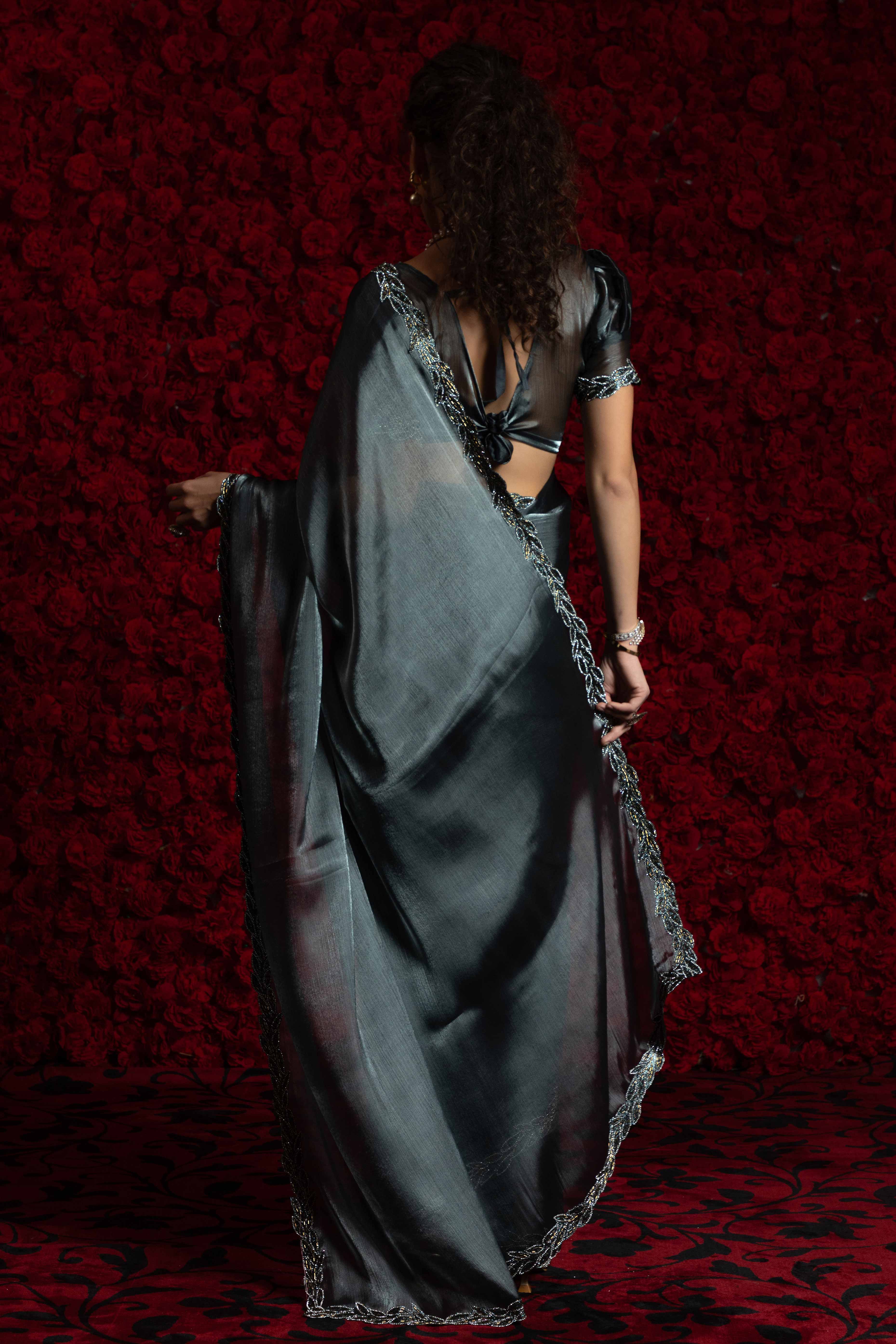 Grey Solid Tissue Chiffon Saree Accented With Elegant Zarkan Work Border