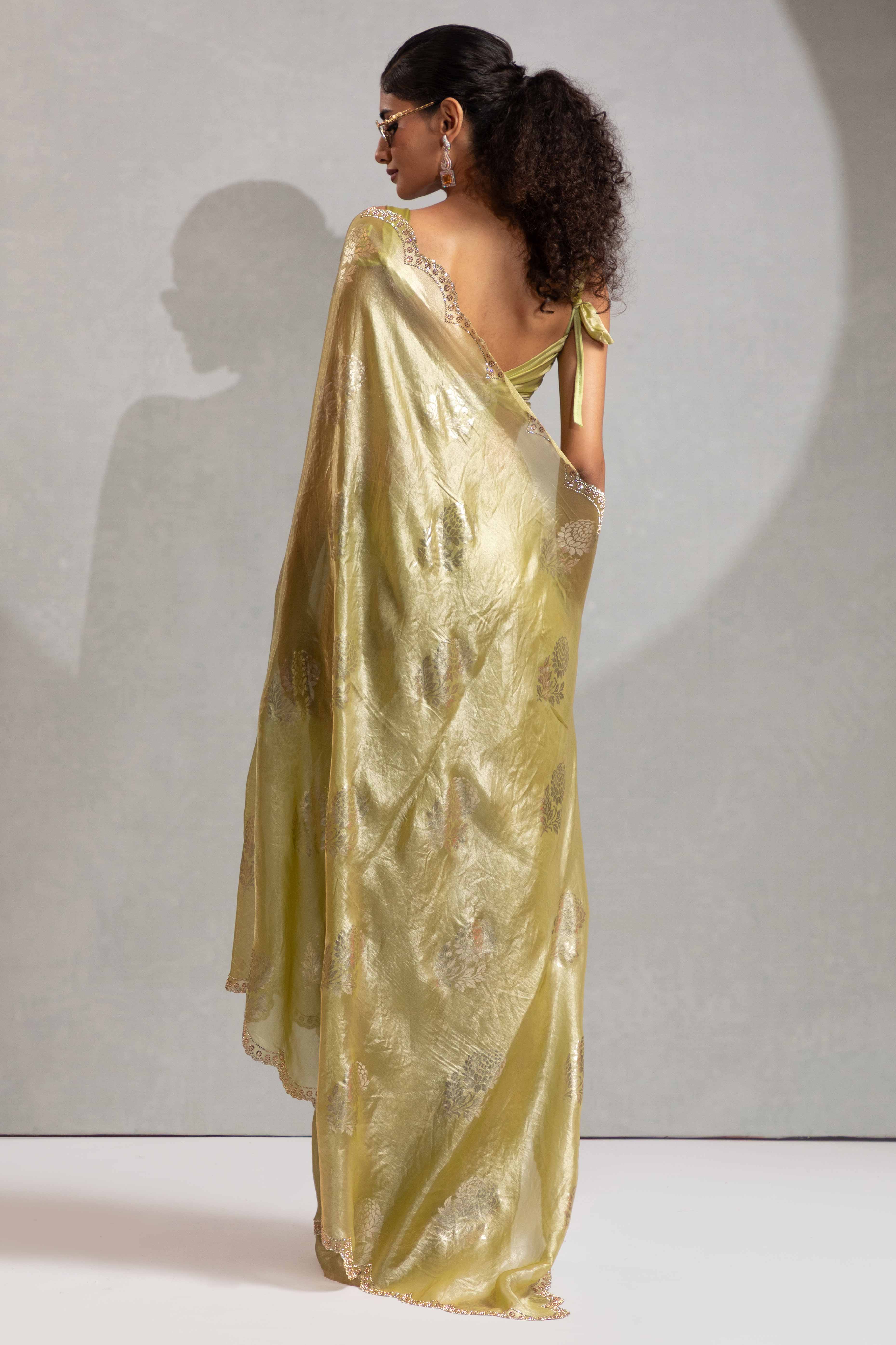 Green Satin Silk Saree Showcasing Elegant Floral Foil Prints & Dazzling Zarkan Work