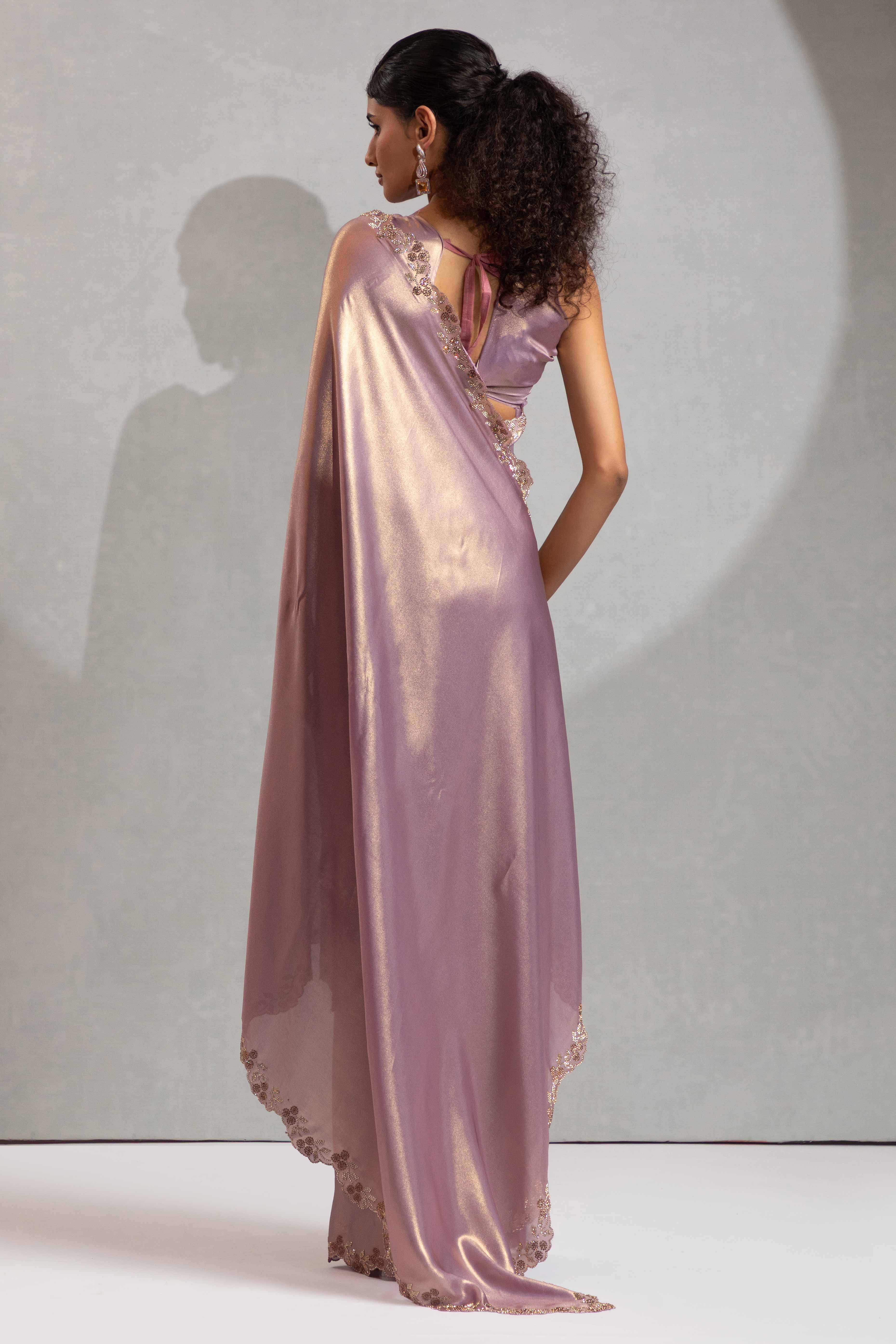 Lavender Satin Georgette Saree Adorned With Subtle Foil Finish & A Sparkling Zarkan Work Border