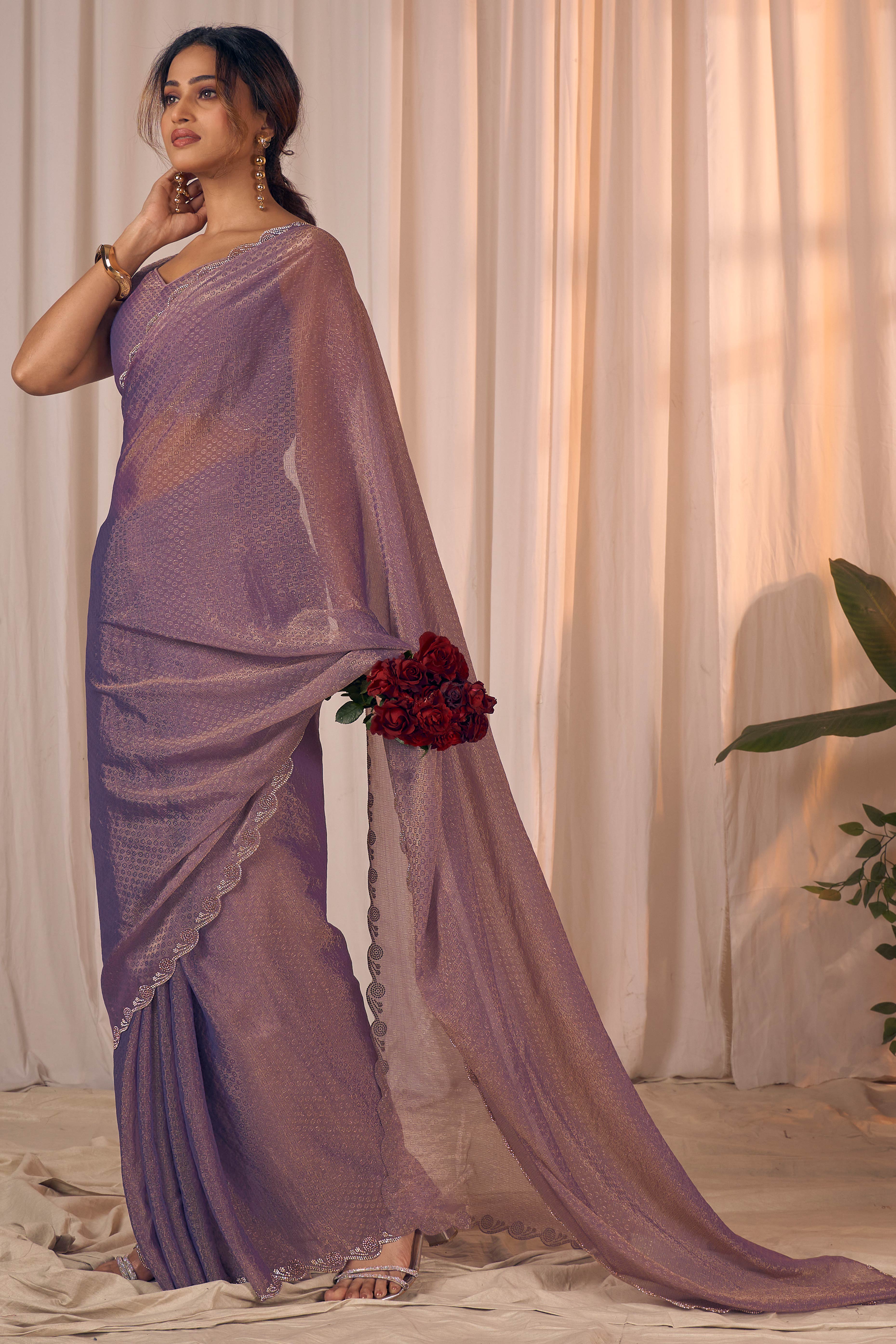 Designer Lavender Georgette Saree Adorned With An Elegant Zarkan Cutwork Border