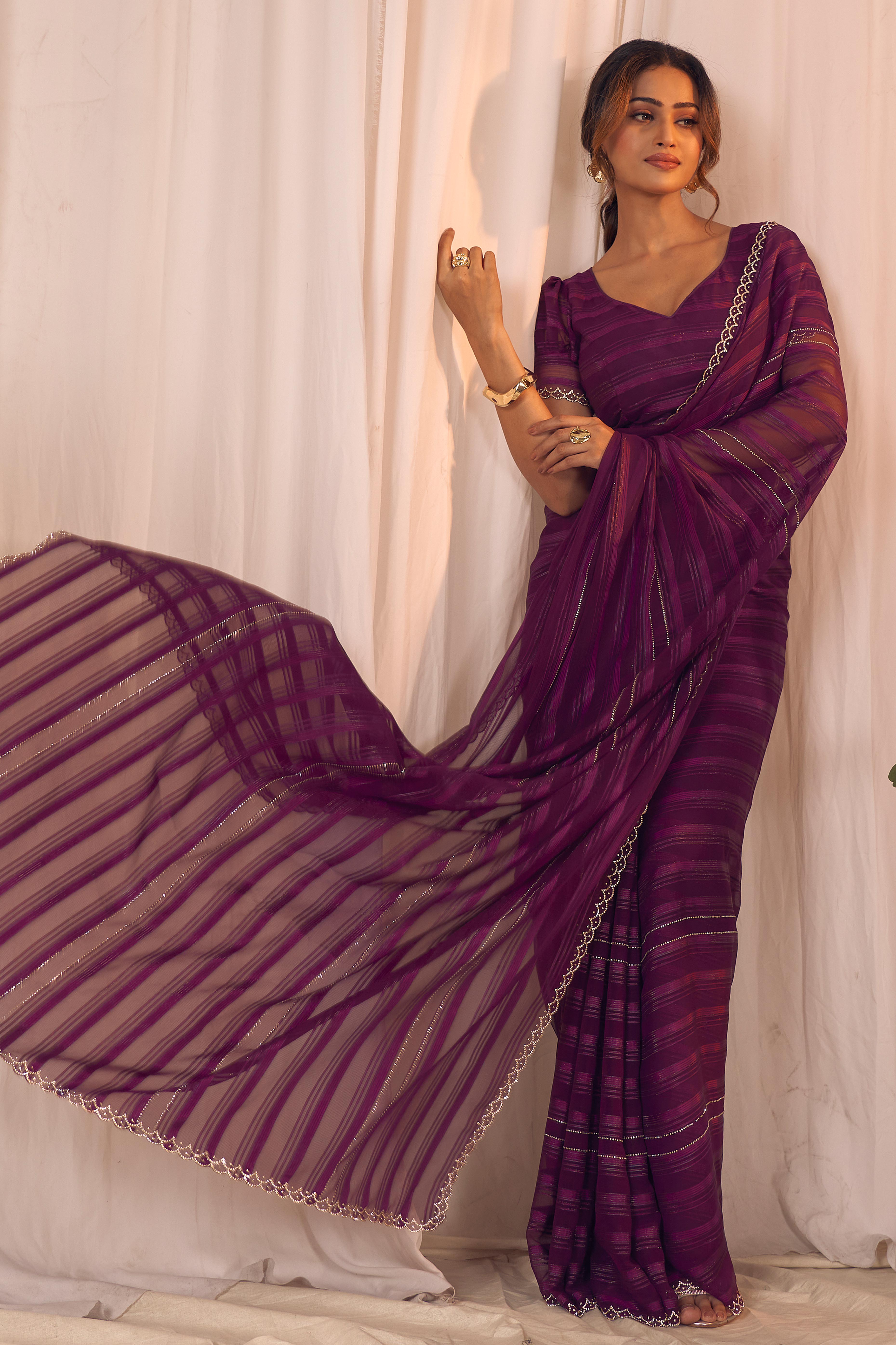 Wine Striped Designer Georgette Saree Adorned With An Elegant Zarkan Cutwork Border