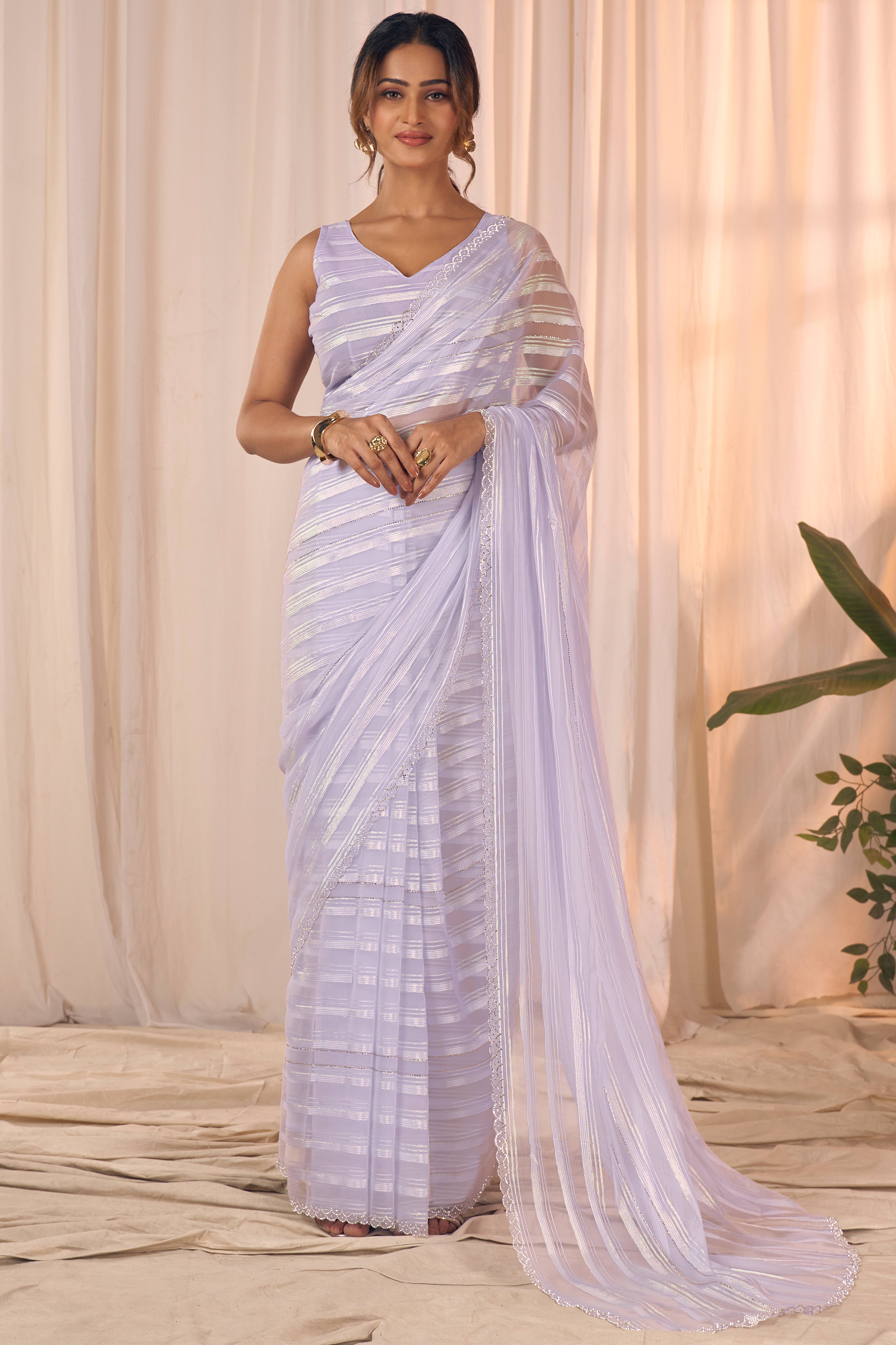 Light Purple Striped Georgette Saree With Sparkling Zarkan Work & An Elegant Cutwork Border