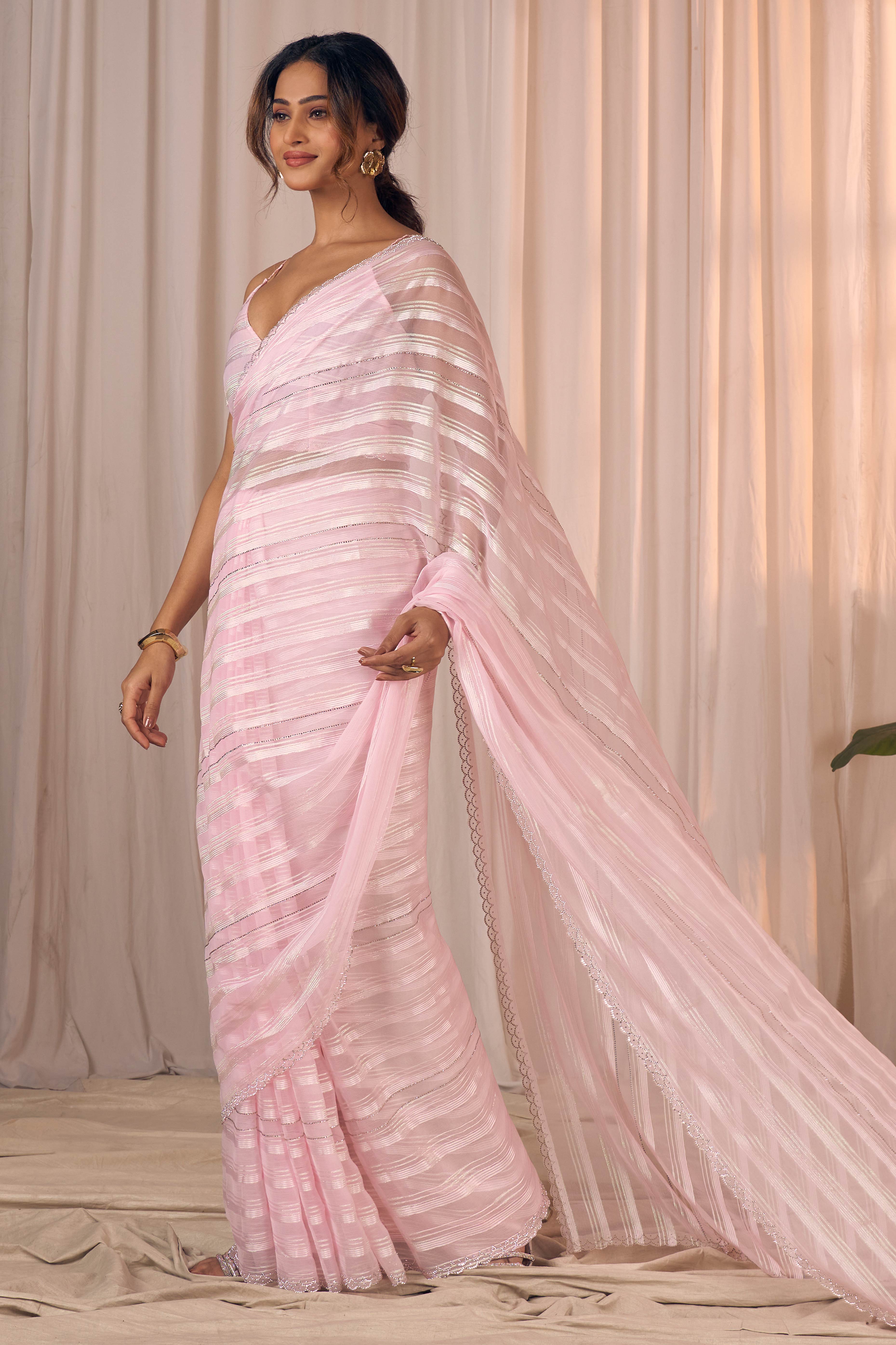 Orchid Pink Striped Georgette Saree With Sparkling Zarkan Work & An Elegant Cutwork Border