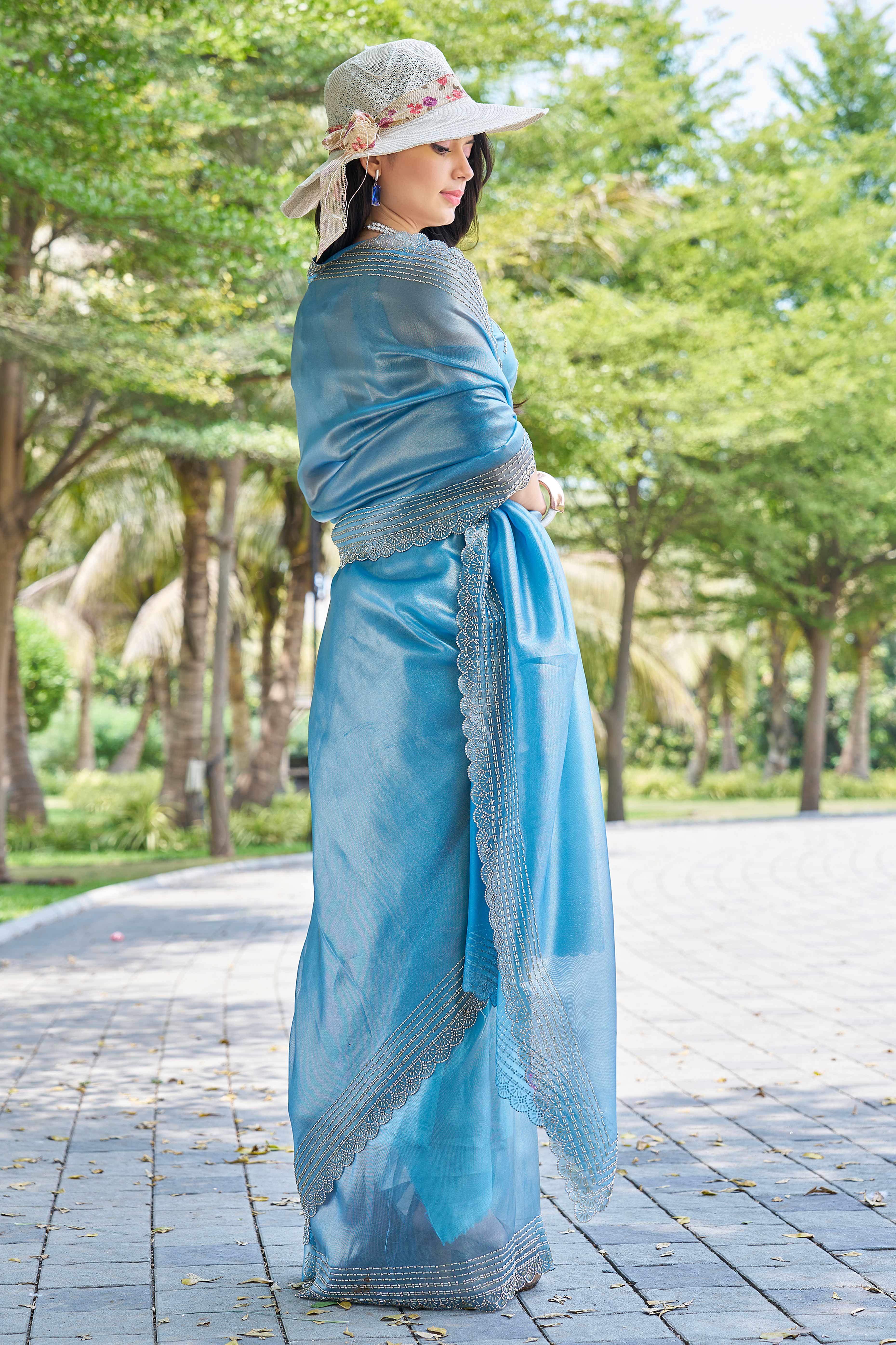 Teal Soft Organza Saree with Stone Embellishments Work