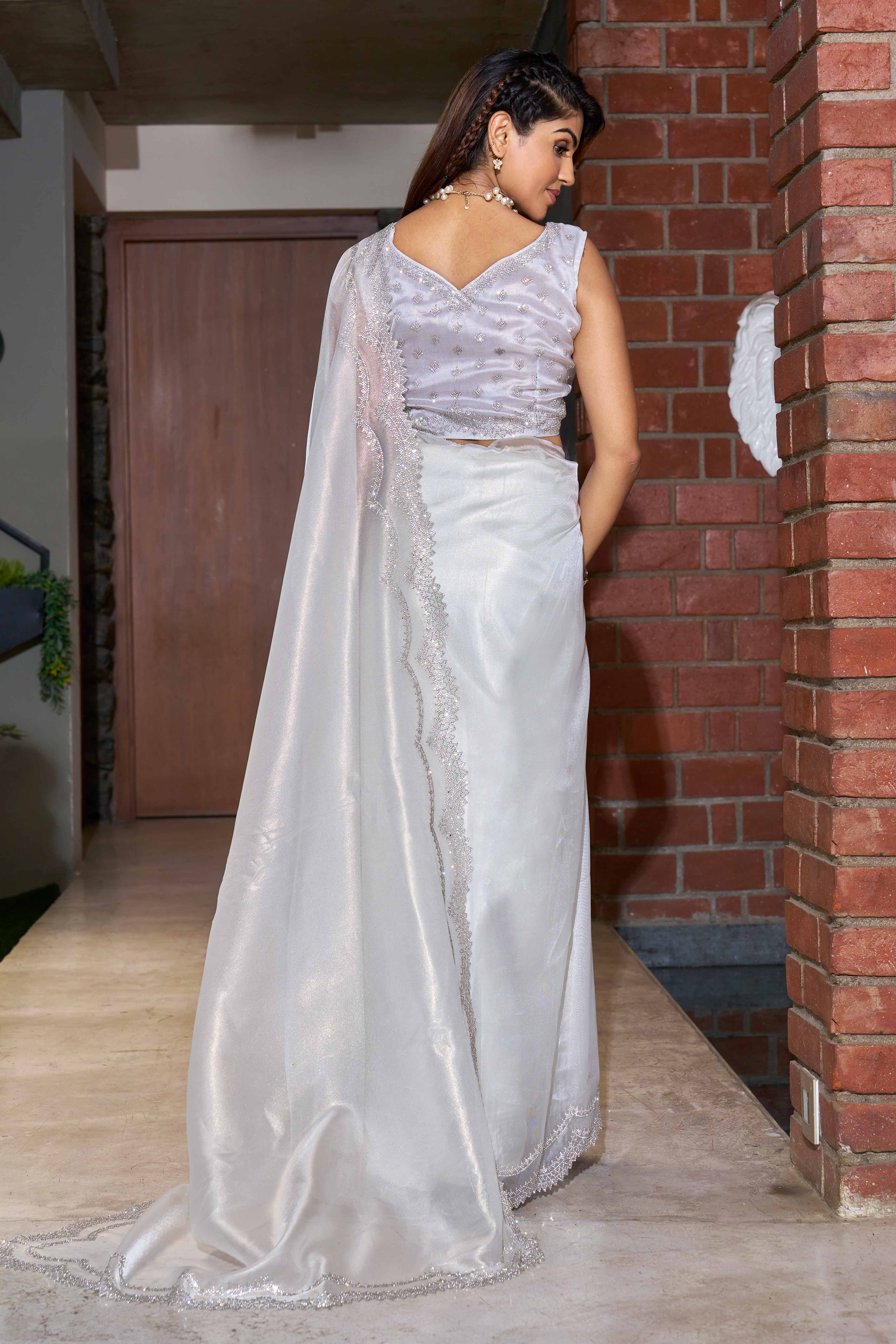 Charming  White Organza Solid Saree With Delicate Embellishments