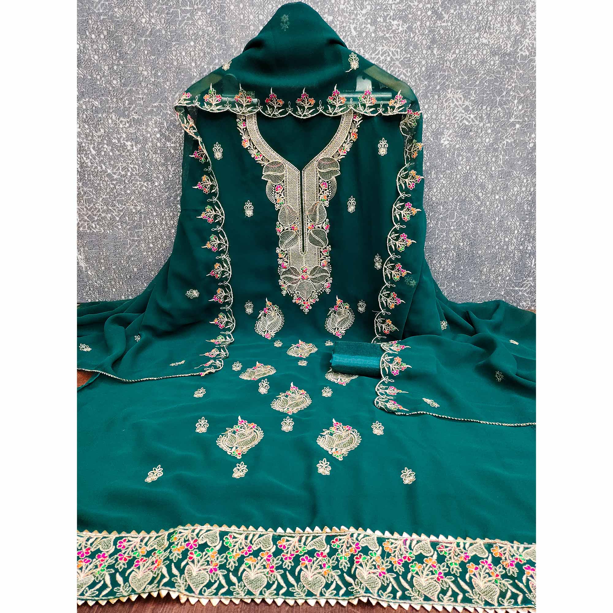 Green Georgette Dress Material Adorned With Floral Embroidery & Elegant Lace Border