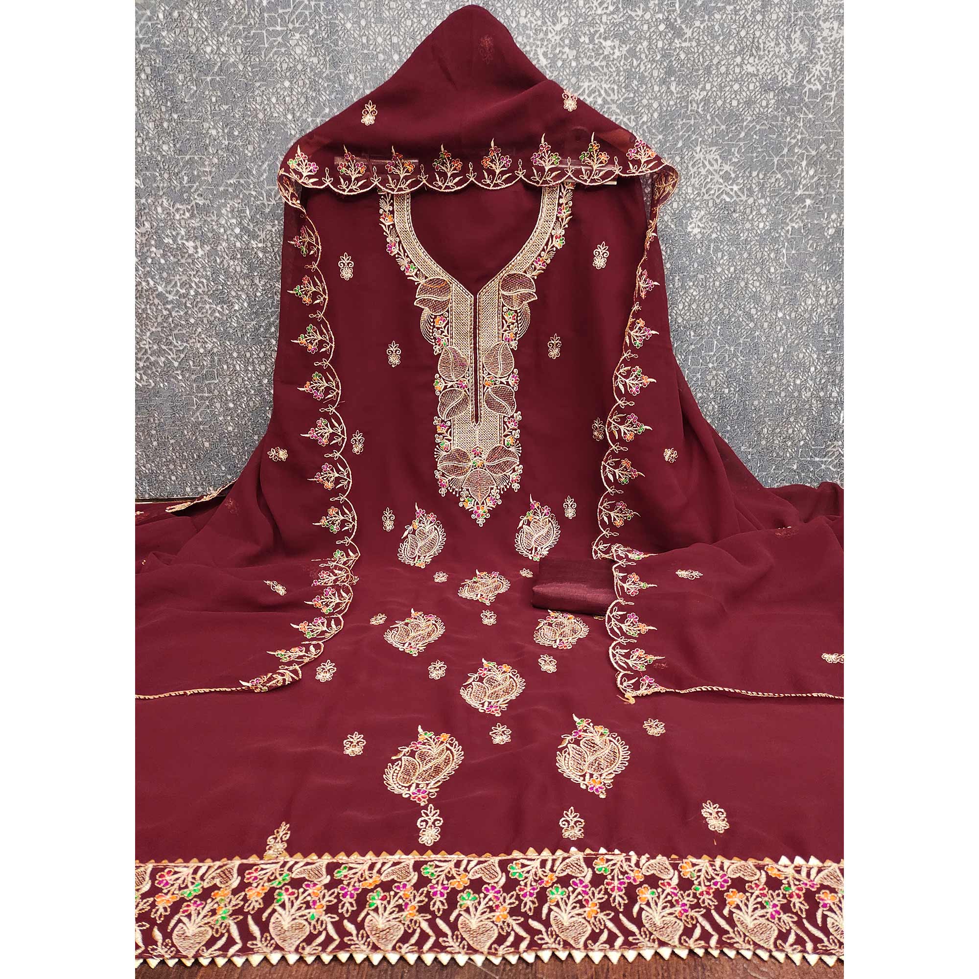 Maroon Georgette Dress Material Adorned With Floral Embroidery & Elegant Lace Border