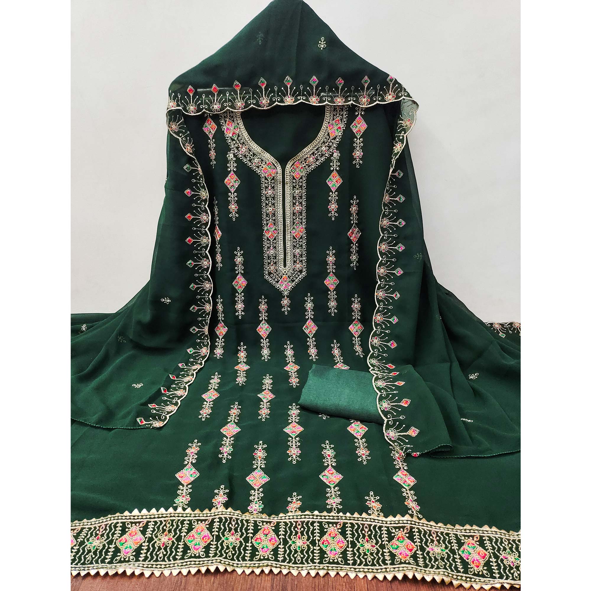 Green Georgette Dress Material Enhanced With Graceful Floral Embroidery For An Elegant Ethnic Look
