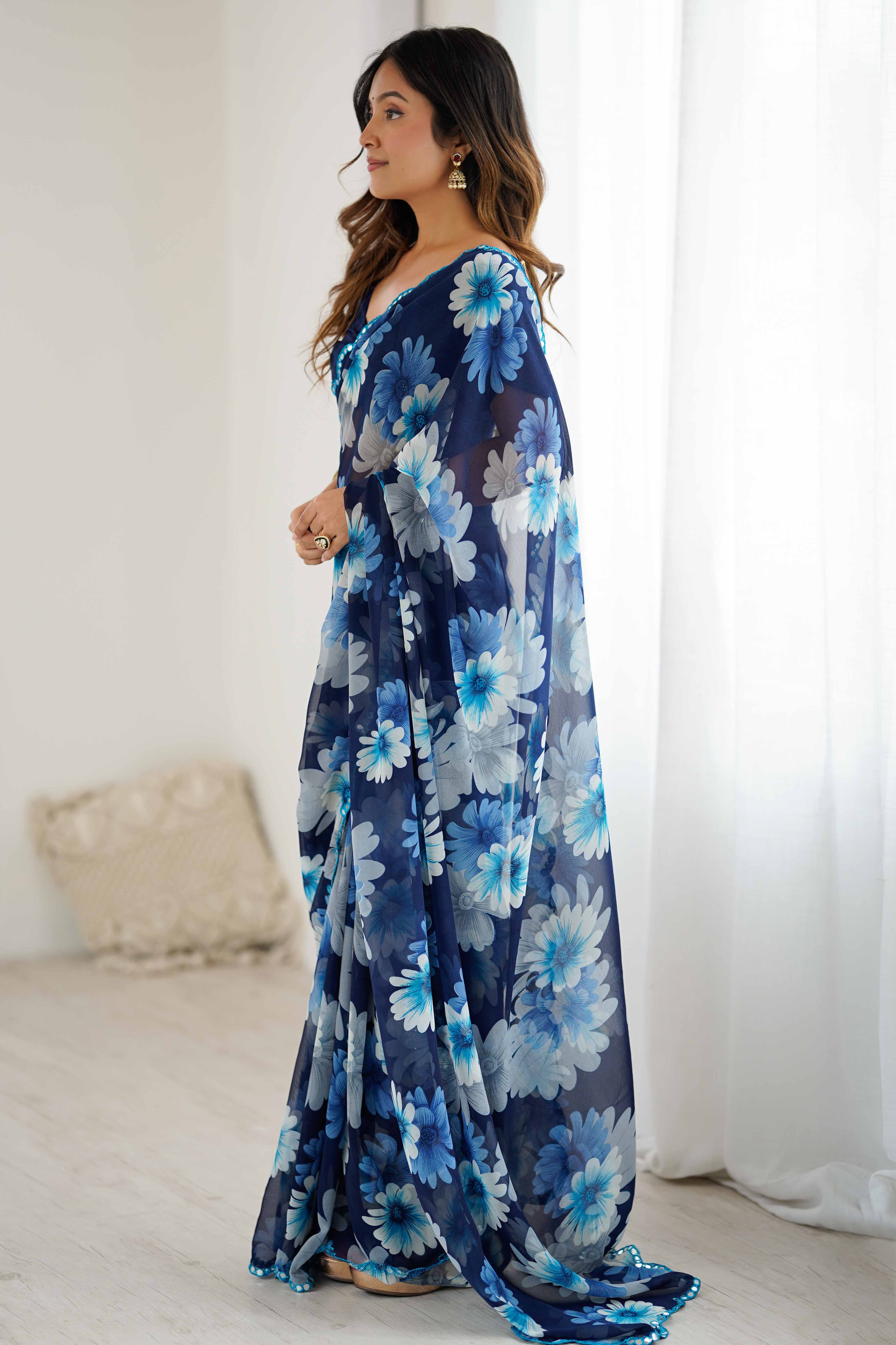 Blue Georgette Saree Featuring Floral Prints & Shimmering Mirror Work Border