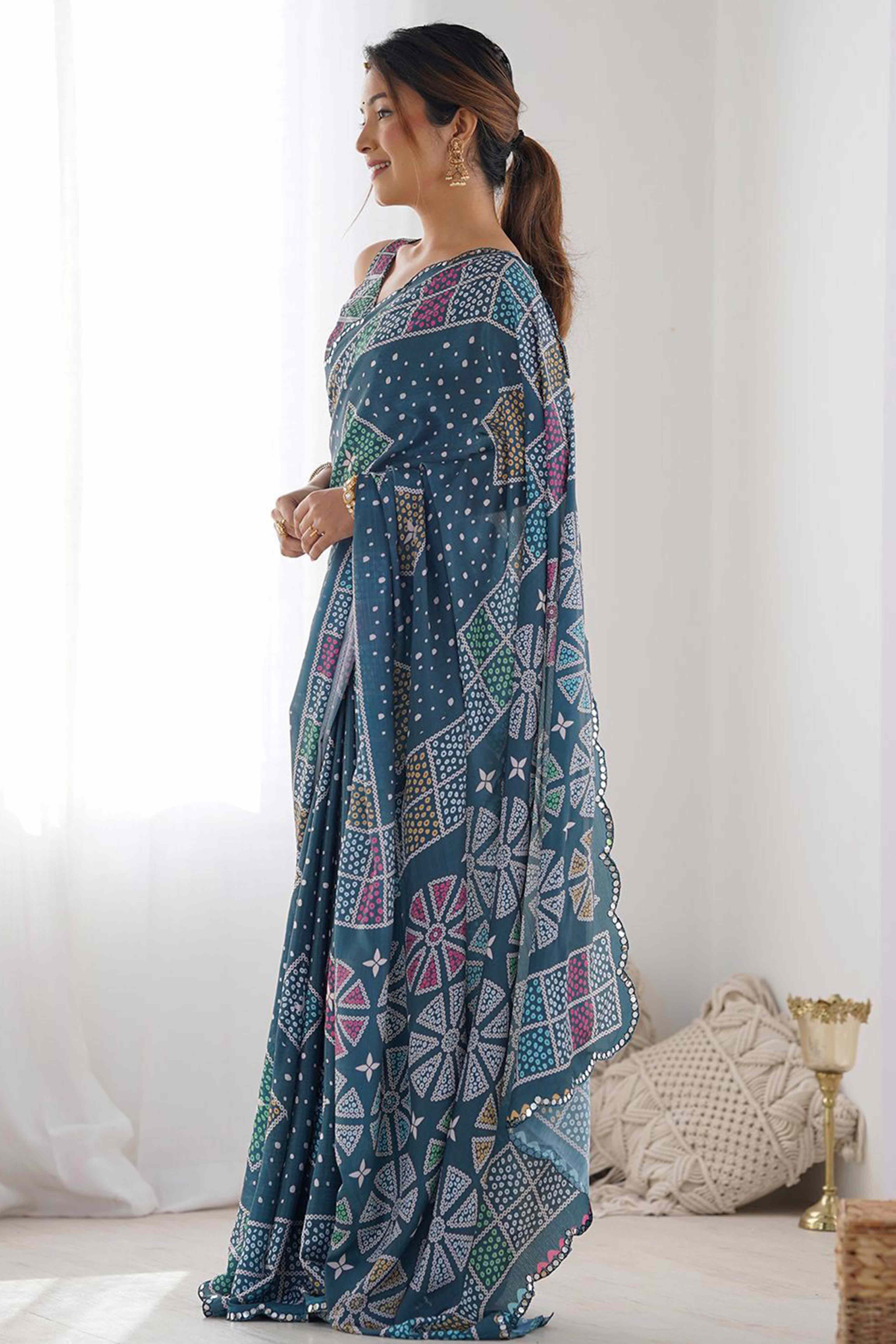 Morpich Blue Bandhani Digital Print Georgette Saree Enhanced With A Sparkling Lace Border
