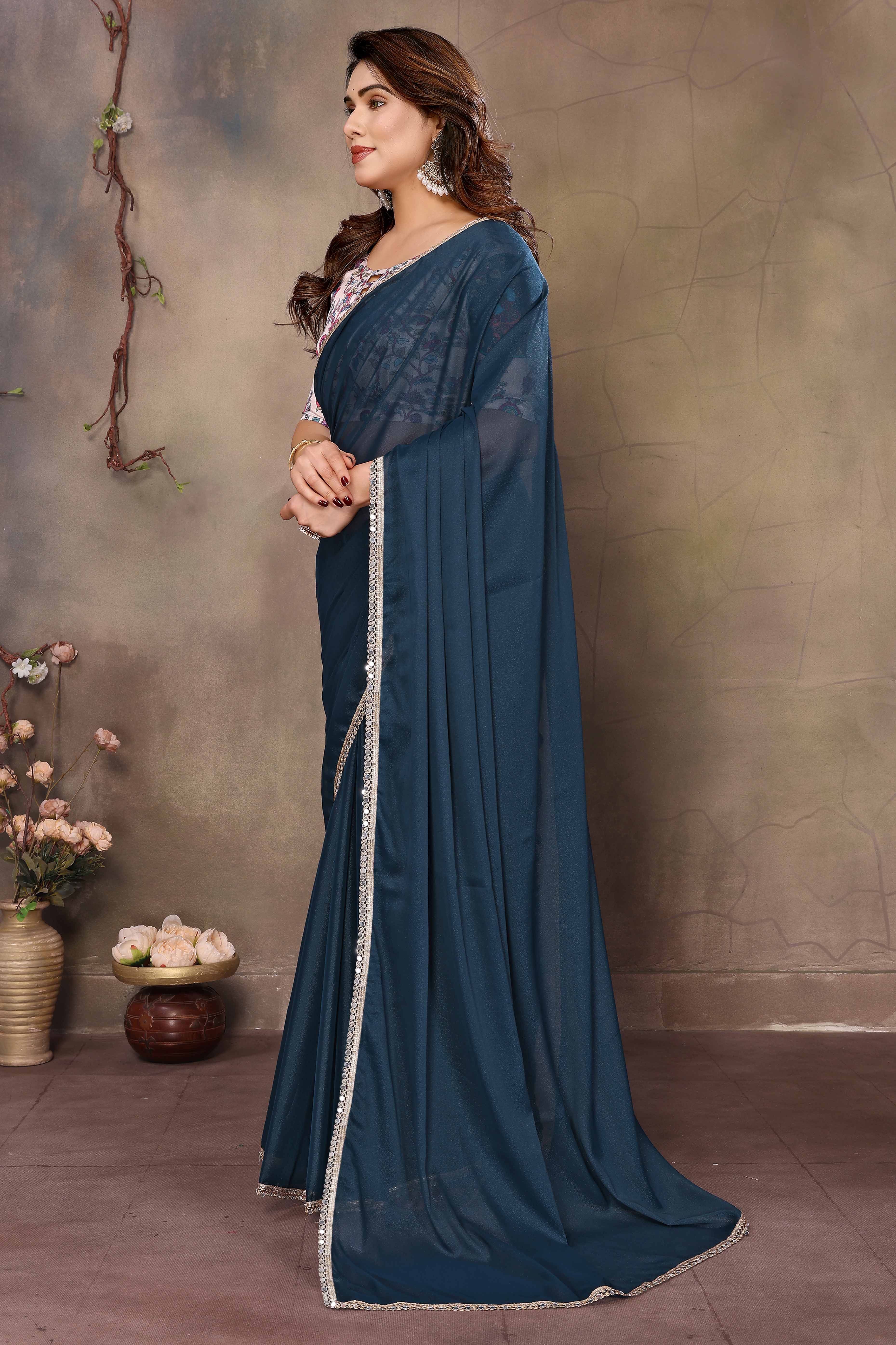 Morpich Blue Solid Sparkling Georgette Saree Enhanced With Shimmering Mirror Border