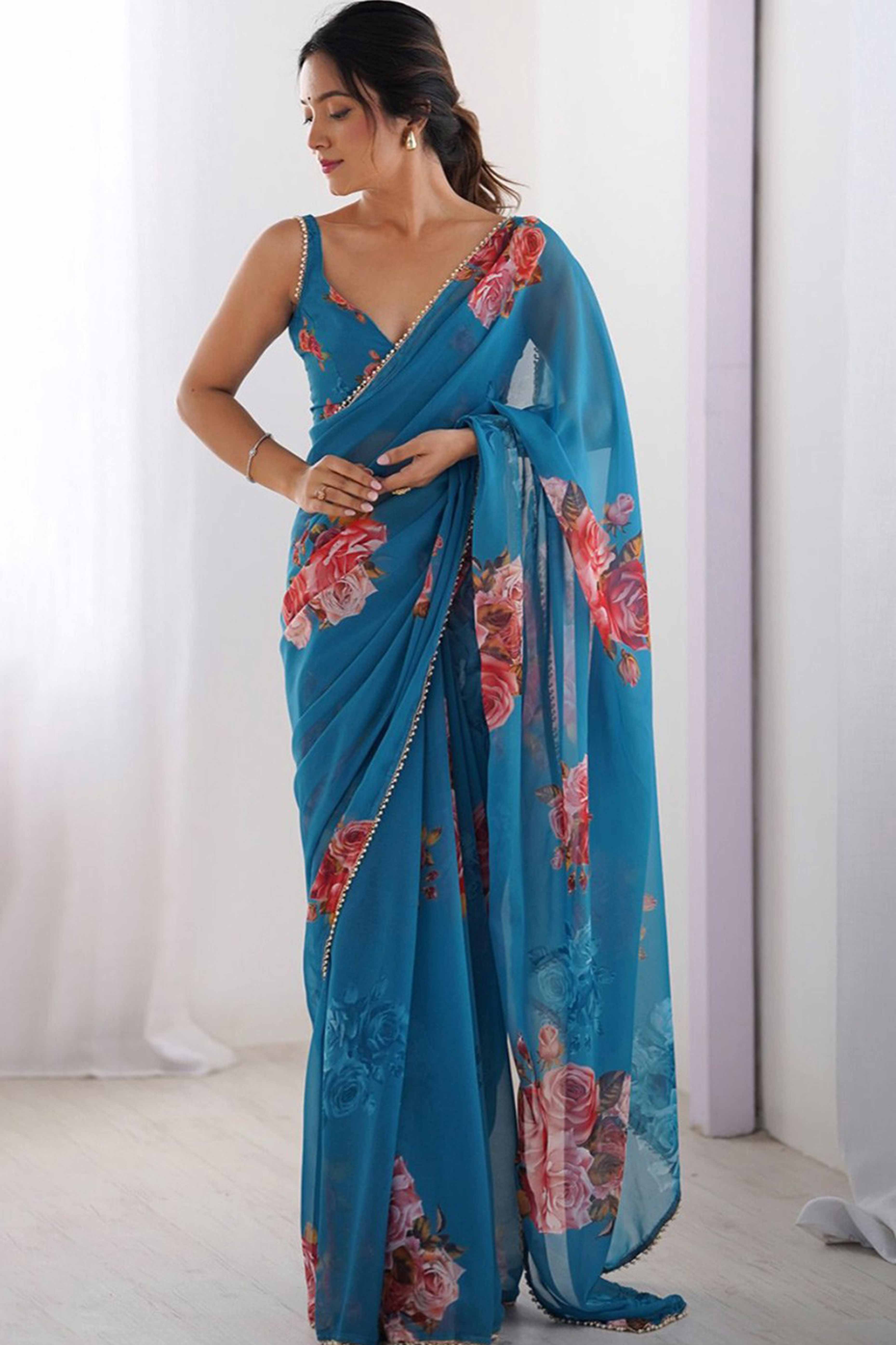 Partywear Teal Georgette Saree with Floral Prints and Bead Work Lace