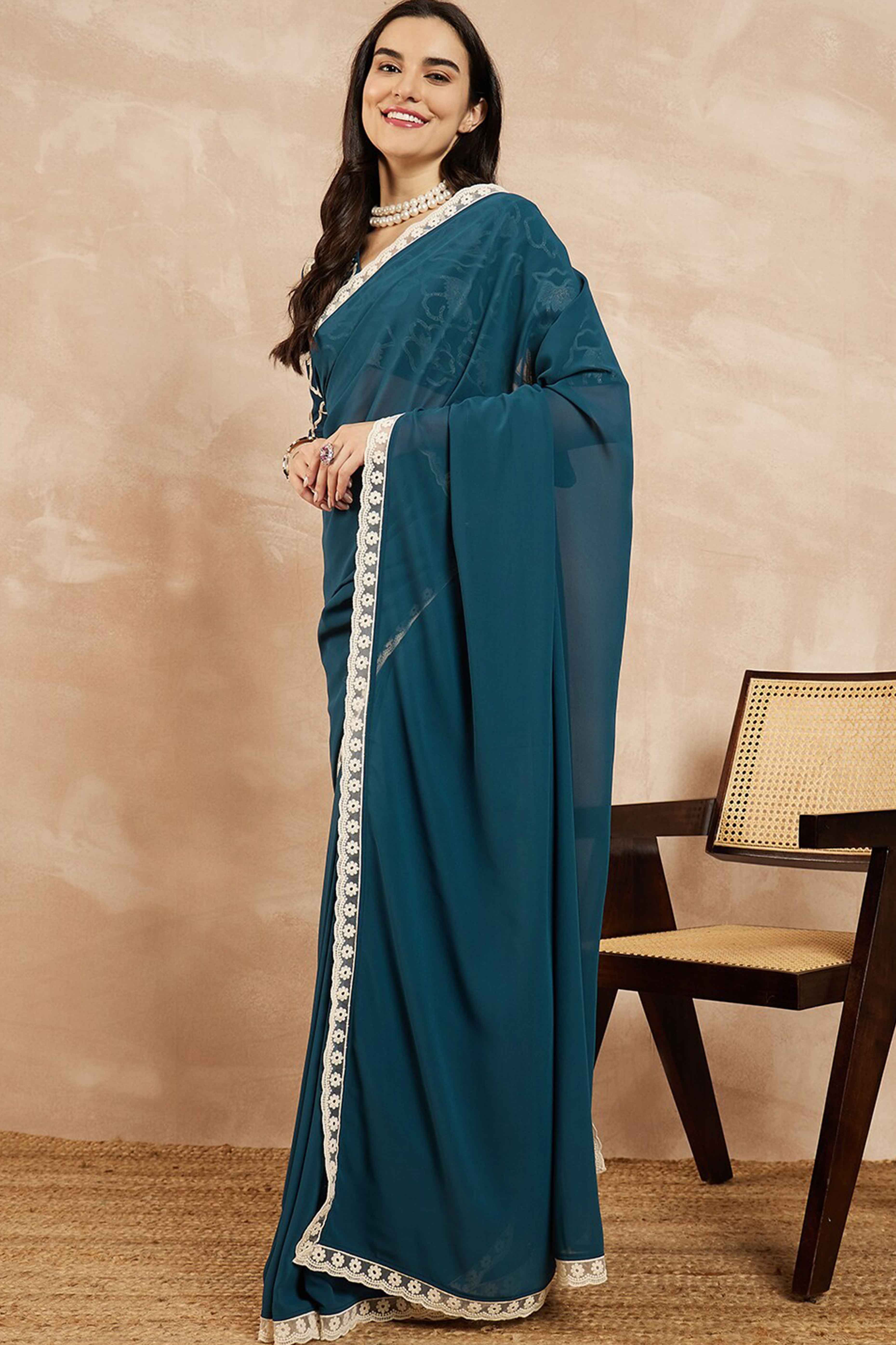 Teal Blue Solid Georgette Saree With Embroidered Border