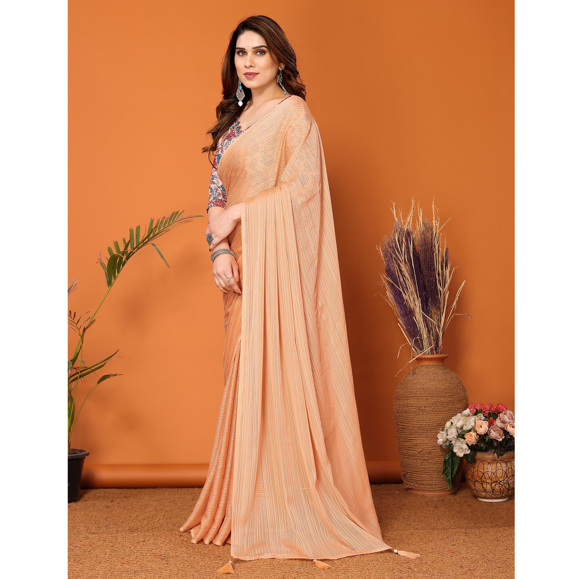 Light Orange Woven Satin Saree With Tassels