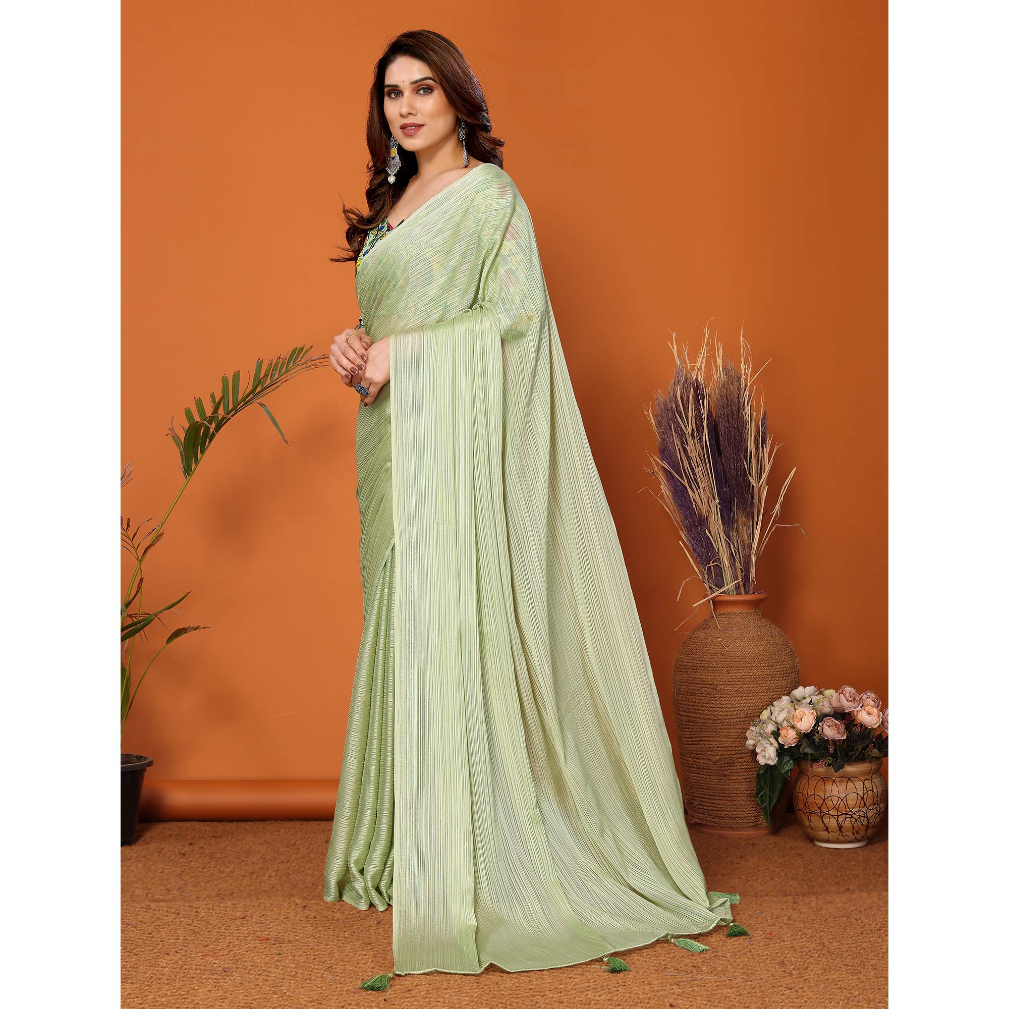 Pista Green Woven Satin Saree With Tassels