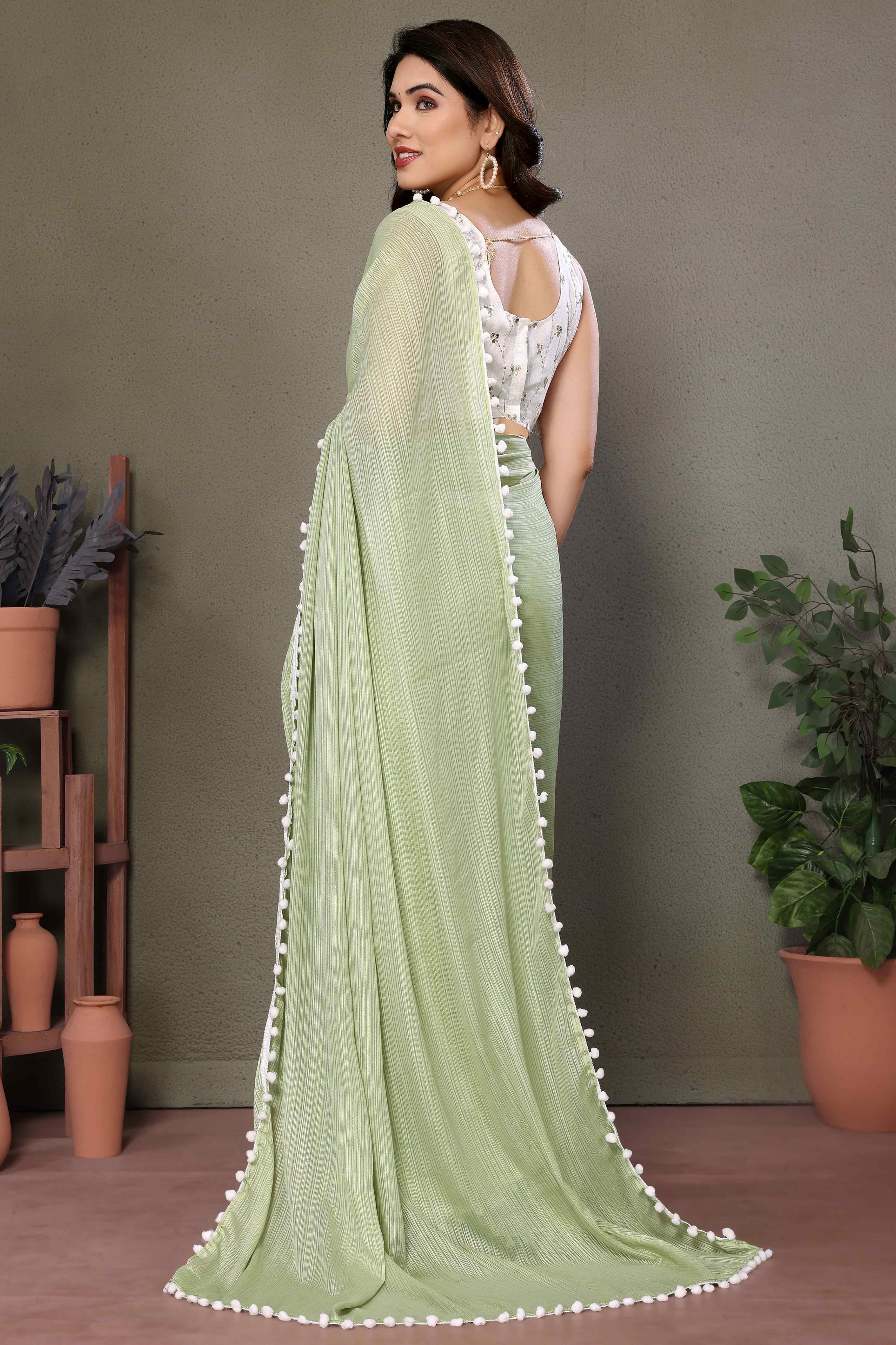 Pista Green Zari Woven Satin Saree With Pompom Border