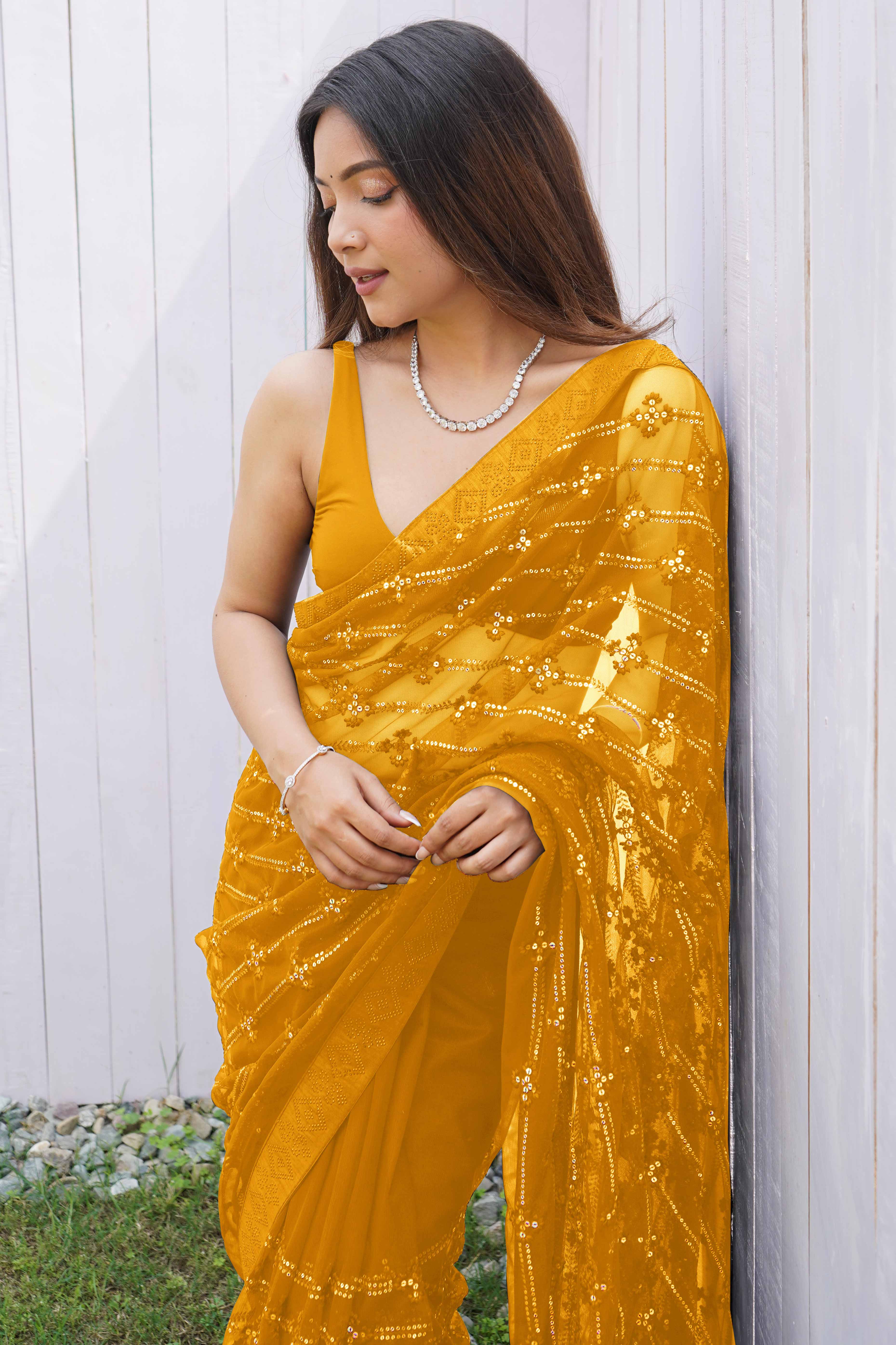 Mustard Net Saree Featuring Intricate Thread & Sequins Work With A Luxe Diamond Border