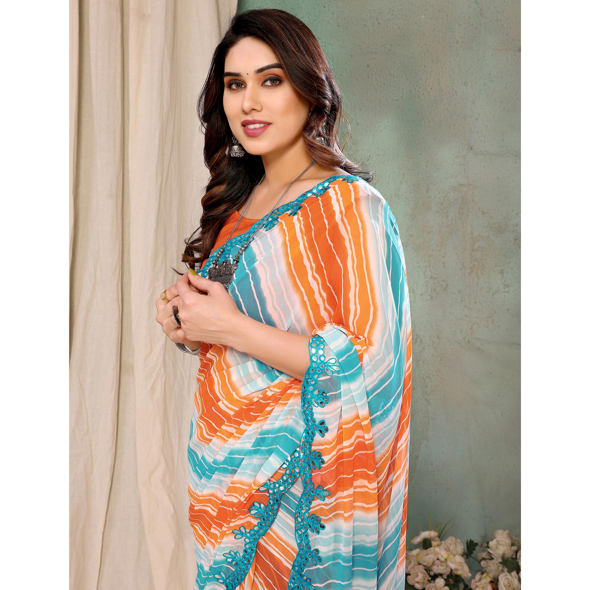 Orange & Sky Blue Printed Georgette Saree With Mirror Work Border