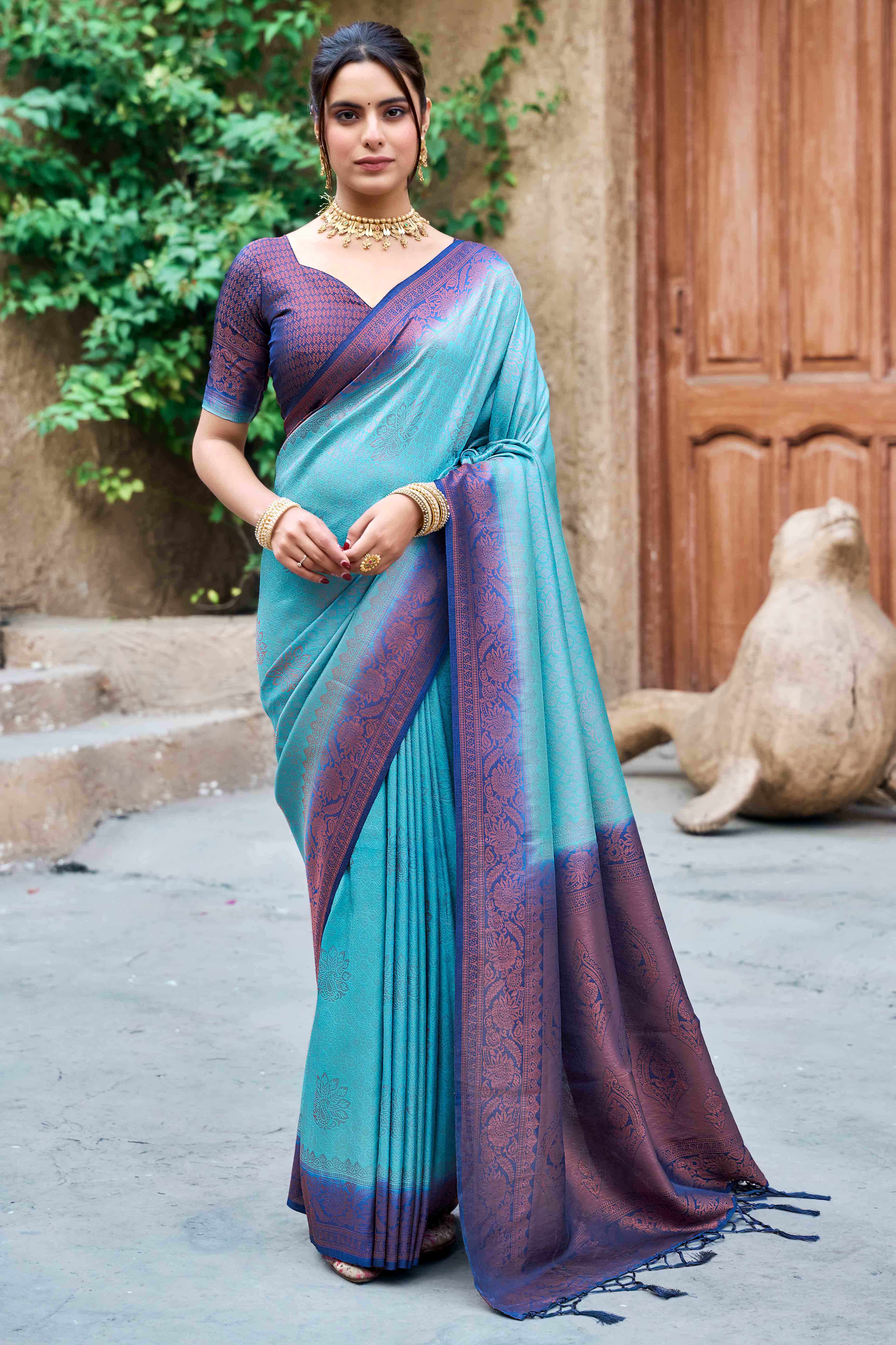 Blue Banarasi Silk Saree Featuring Elegant Floral Woven & Delicate Tassel Edging