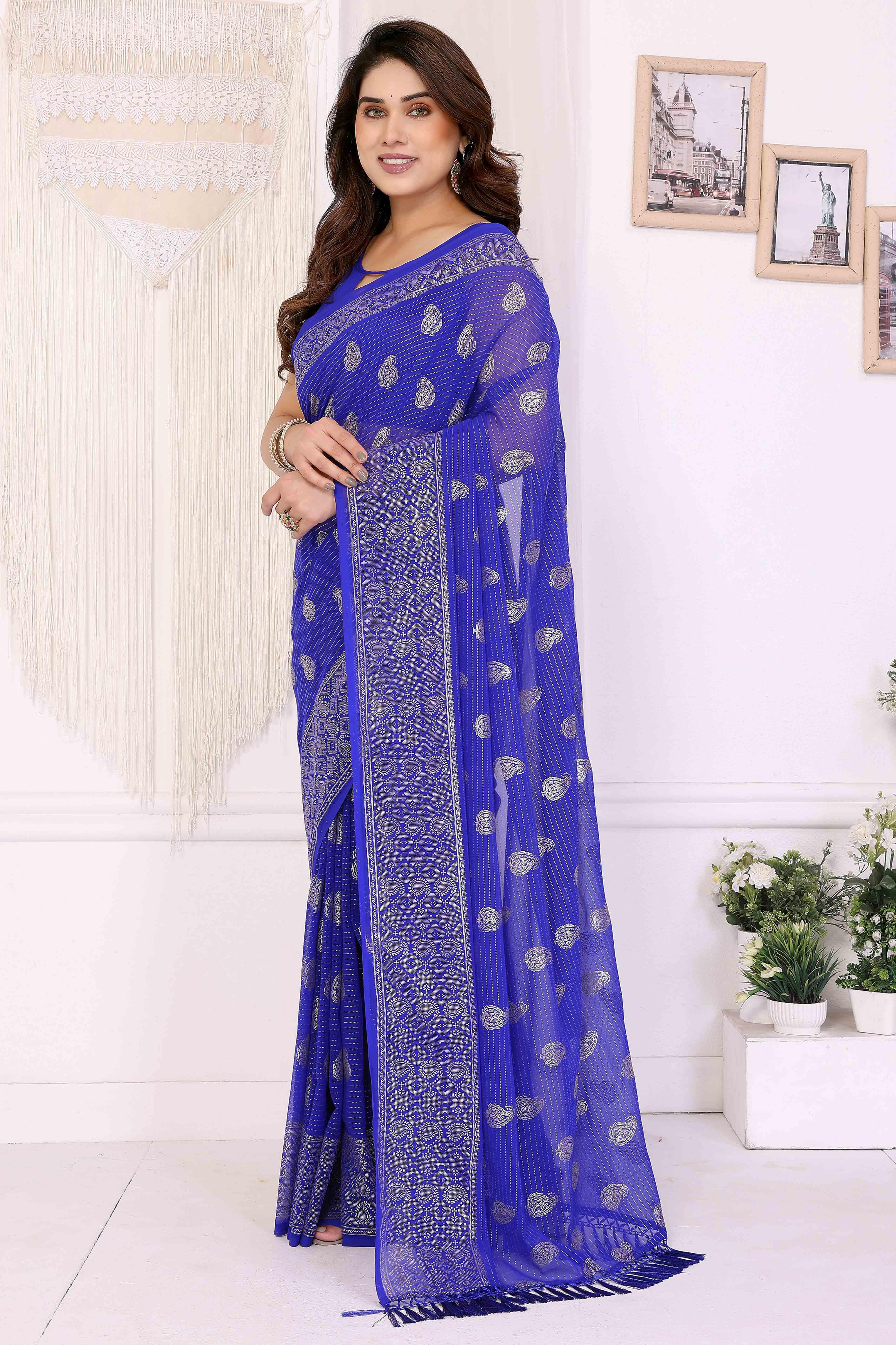 Royal Blue Foil Printed Georgette Saree Enhanced With Delicate Lace Border & Elegant Tassel
