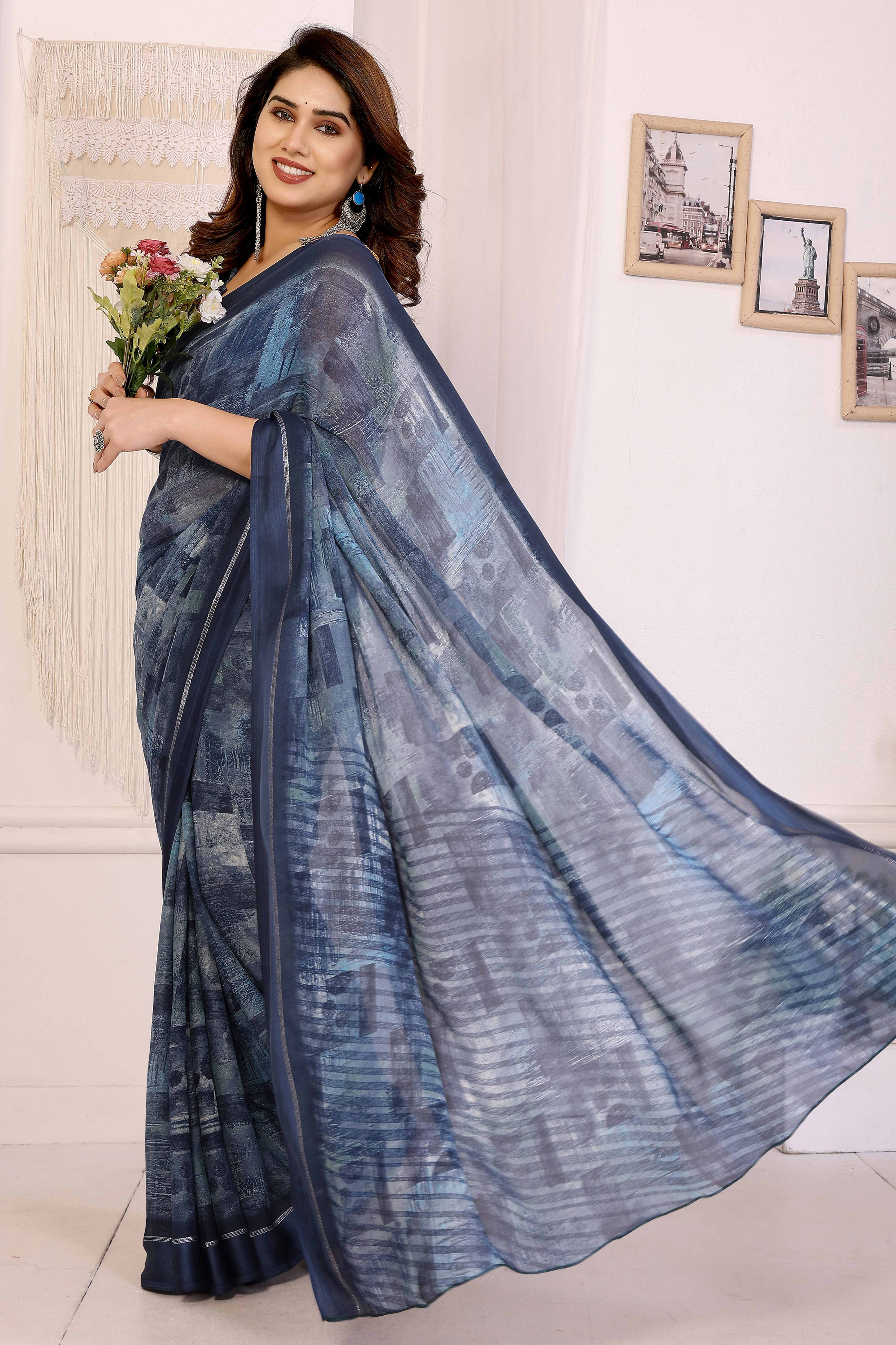 Trendy Blue Moss Crepe Saree with Floral Motifs and Satin Border