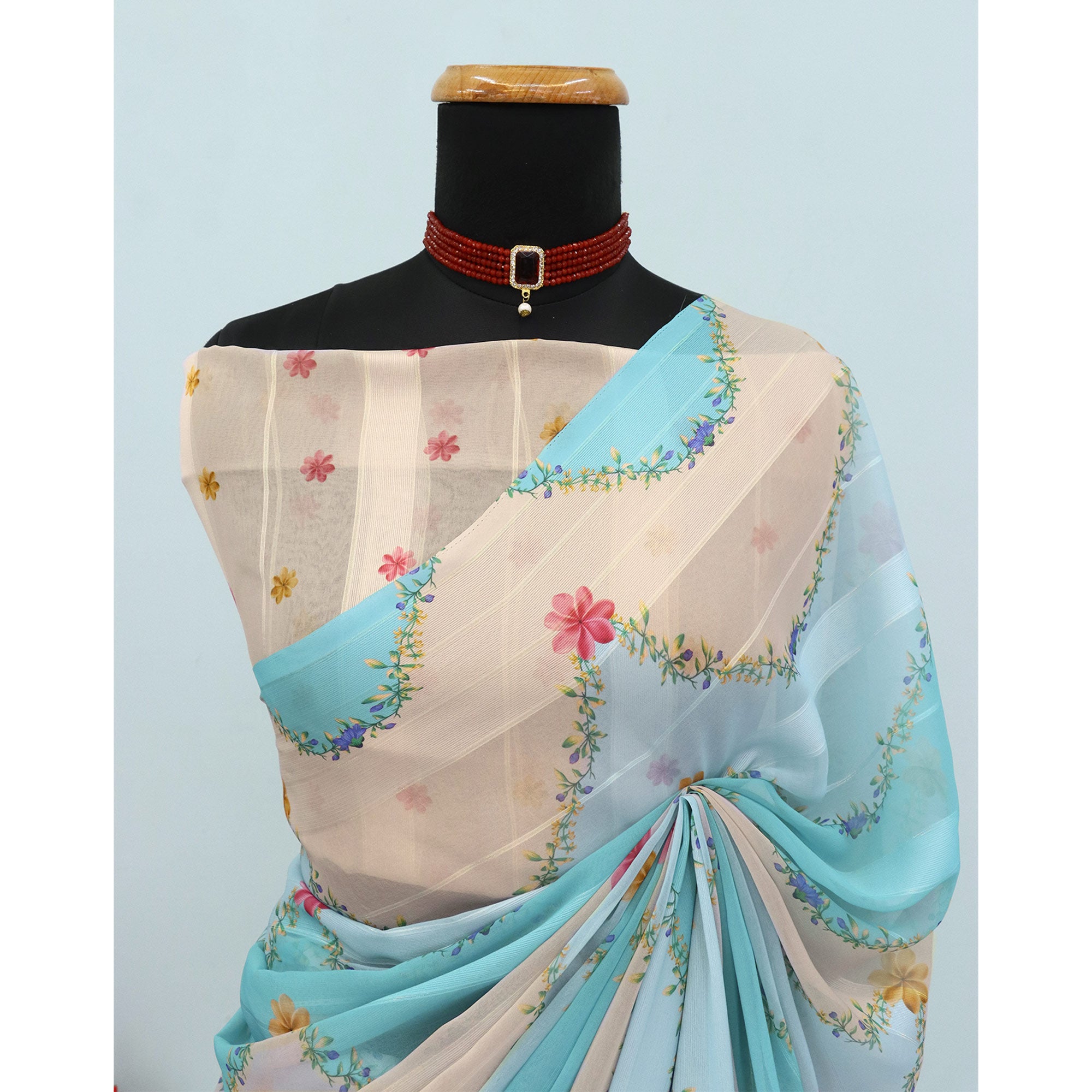 Sky Blue Bloom Floral Digital Printed Georgette Saree Accentuated With Graceful Zari Stripes