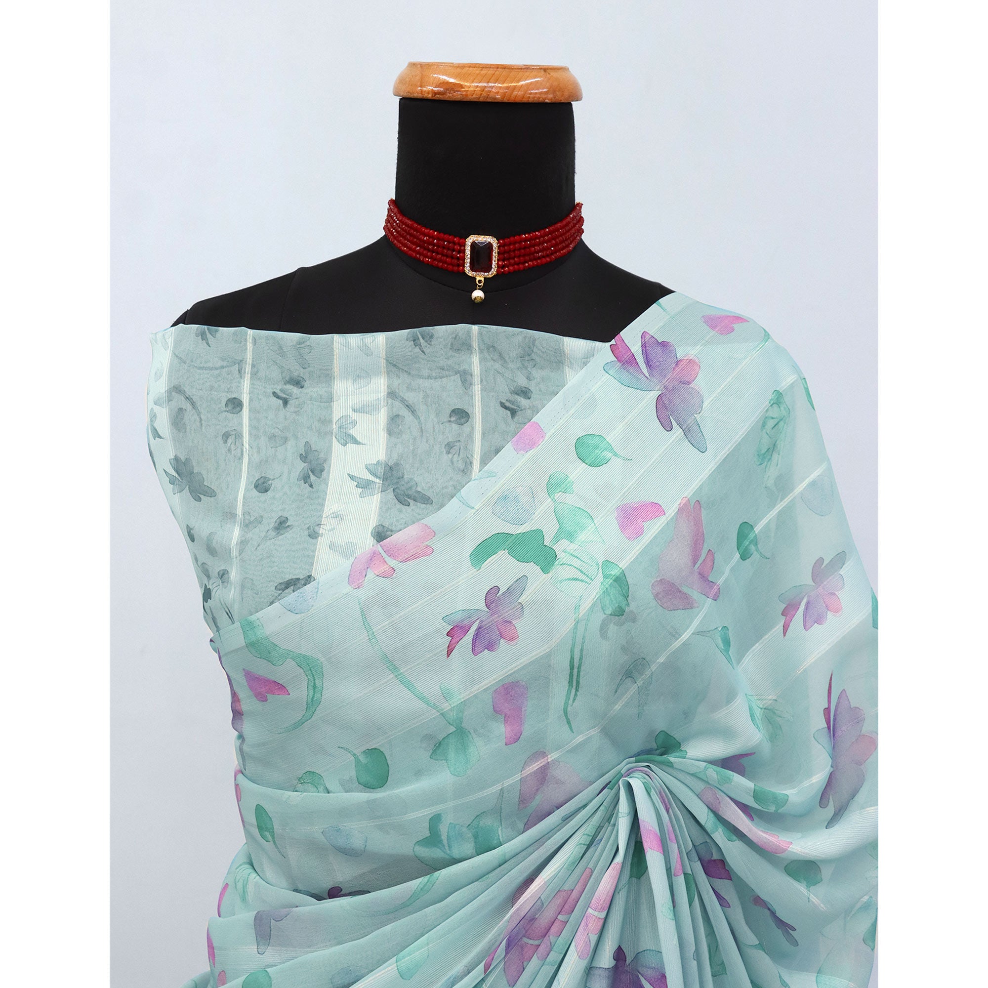 Sky Blue Bloom Floral Digital Printed Georgette Saree Accentuated With Graceful Zari Stripes