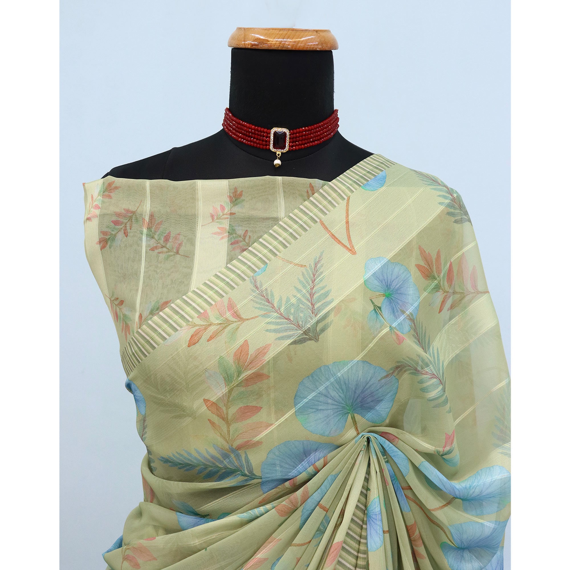 Pista Green Bloom Floral Digital Printed Georgette Saree Accentuated With Graceful Zari Stripes