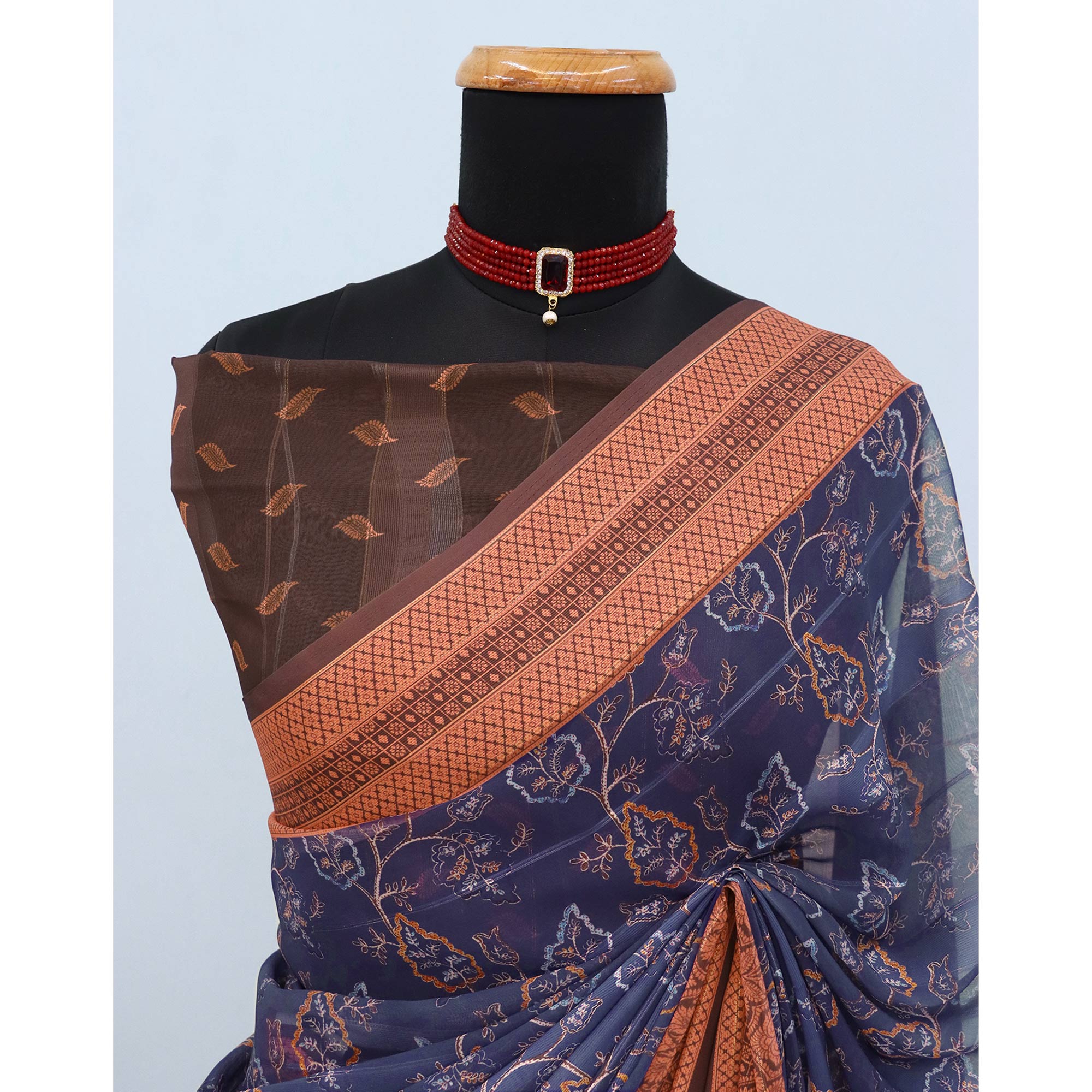 Elegant Navy Blue & Brown Floral Digital Printed Georgette Saree Adorned With Subtle Zari Stripes