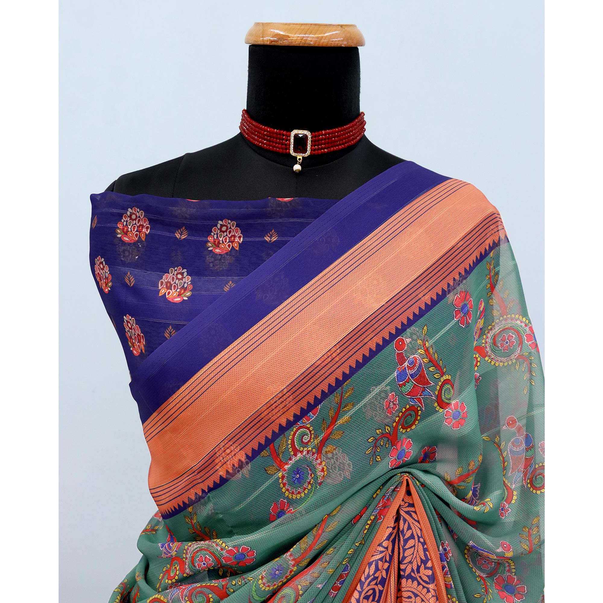 Elegant Rama Green & Blue Floral Digital Printed Georgette Saree Adorned With Subtle Zari Stripes