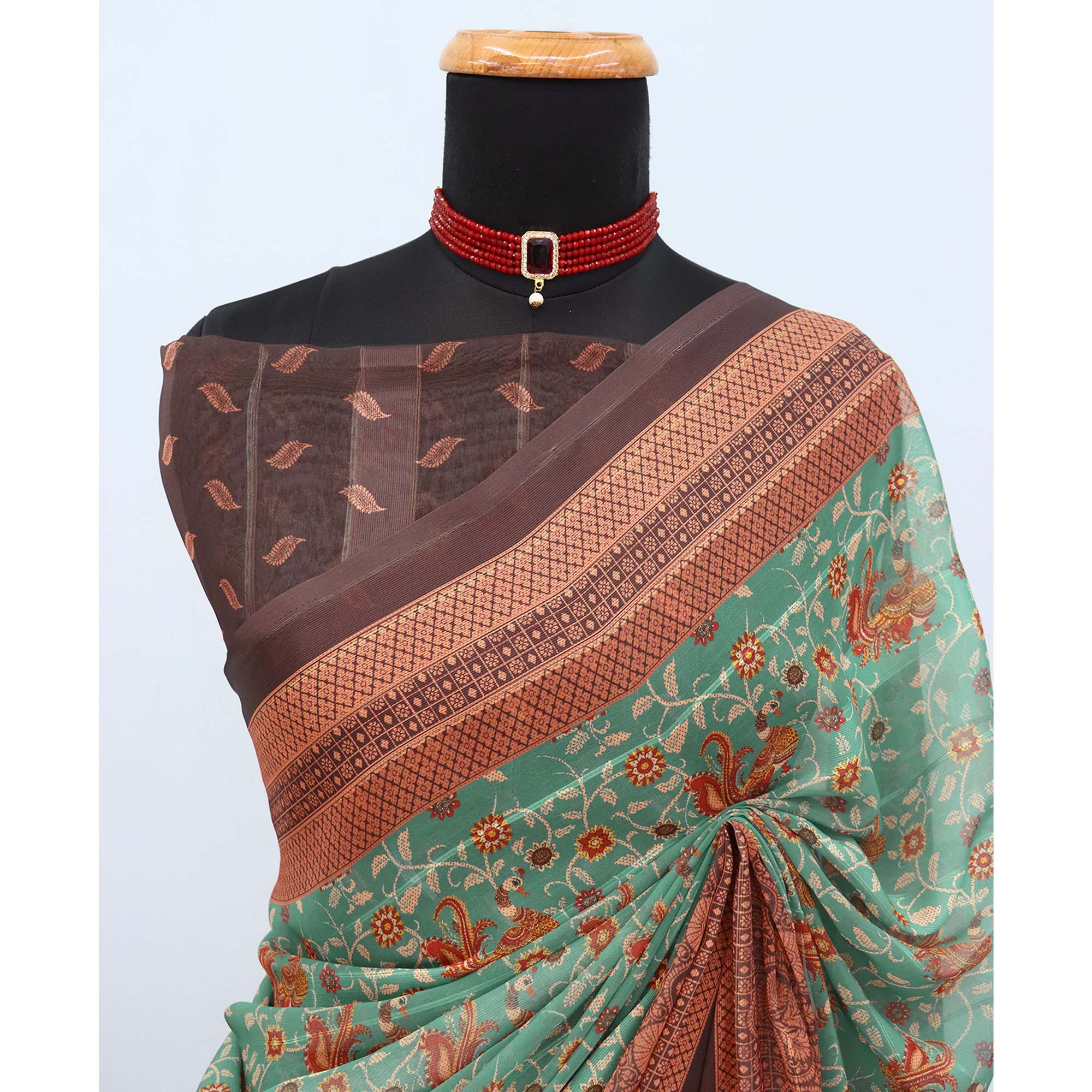 Elegant Green & Brown Floral Digital Printed Georgette Saree Adorned With Subtle Zari Stripes