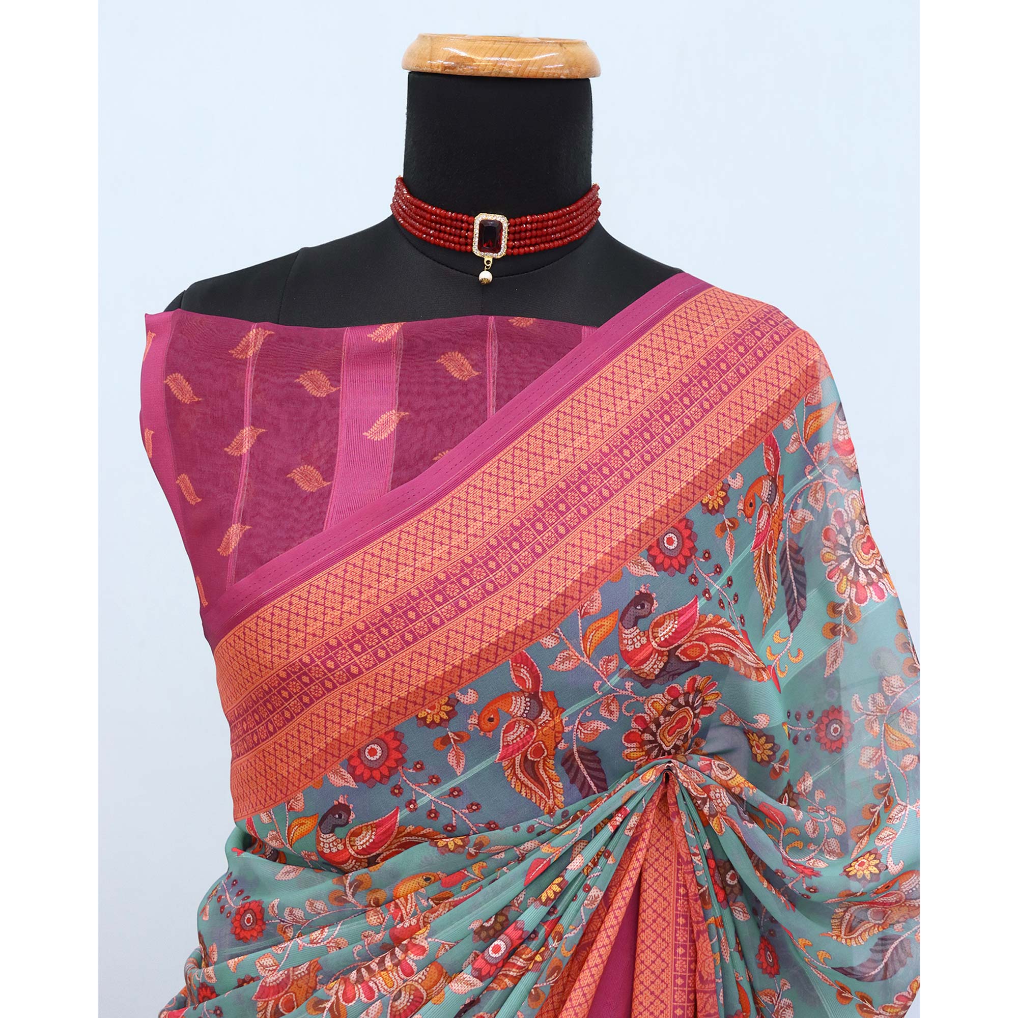 Elegant Rama Blue & Magenta Floral Digital Printed Georgette Saree Adorned With Subtle Zari Stripes