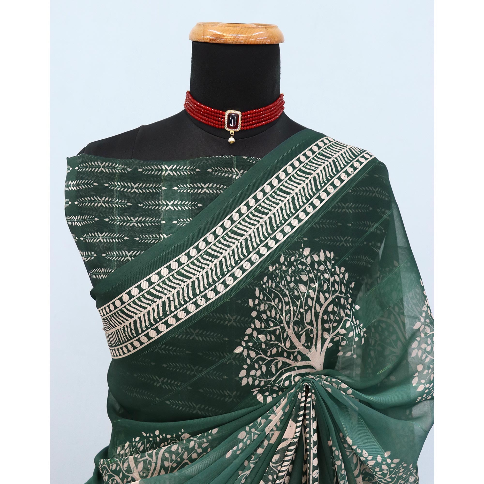 Charming Green Digital Tree Printed Georgette Saree Accentuated With Zari Stripes