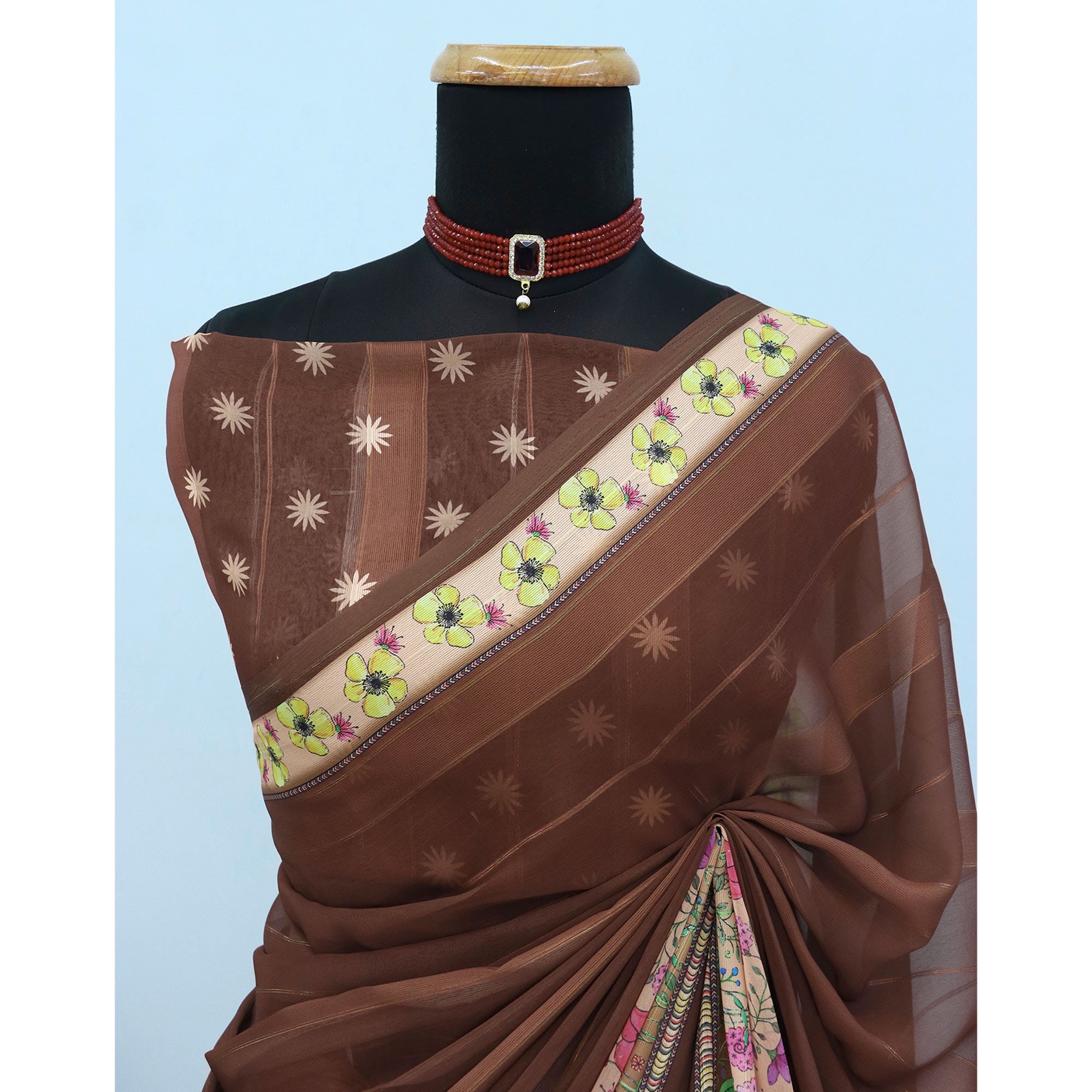 Charming Brown Floral Digital Printed Georgette Saree Accentuated With Zari Stripes