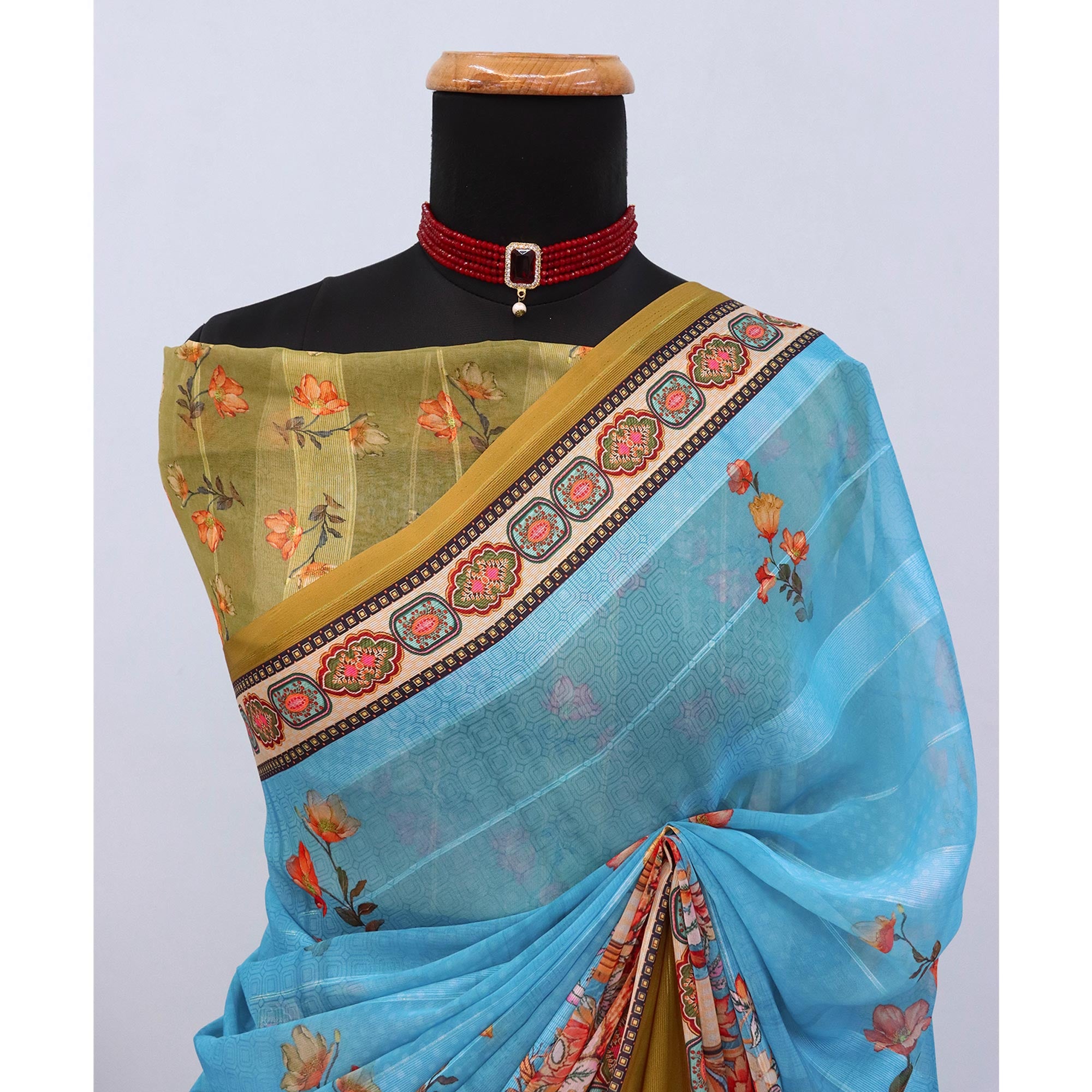 Charming Blue & Mehendi Floral Digital Printed Georgette Saree Accentuated With Zari Stripes