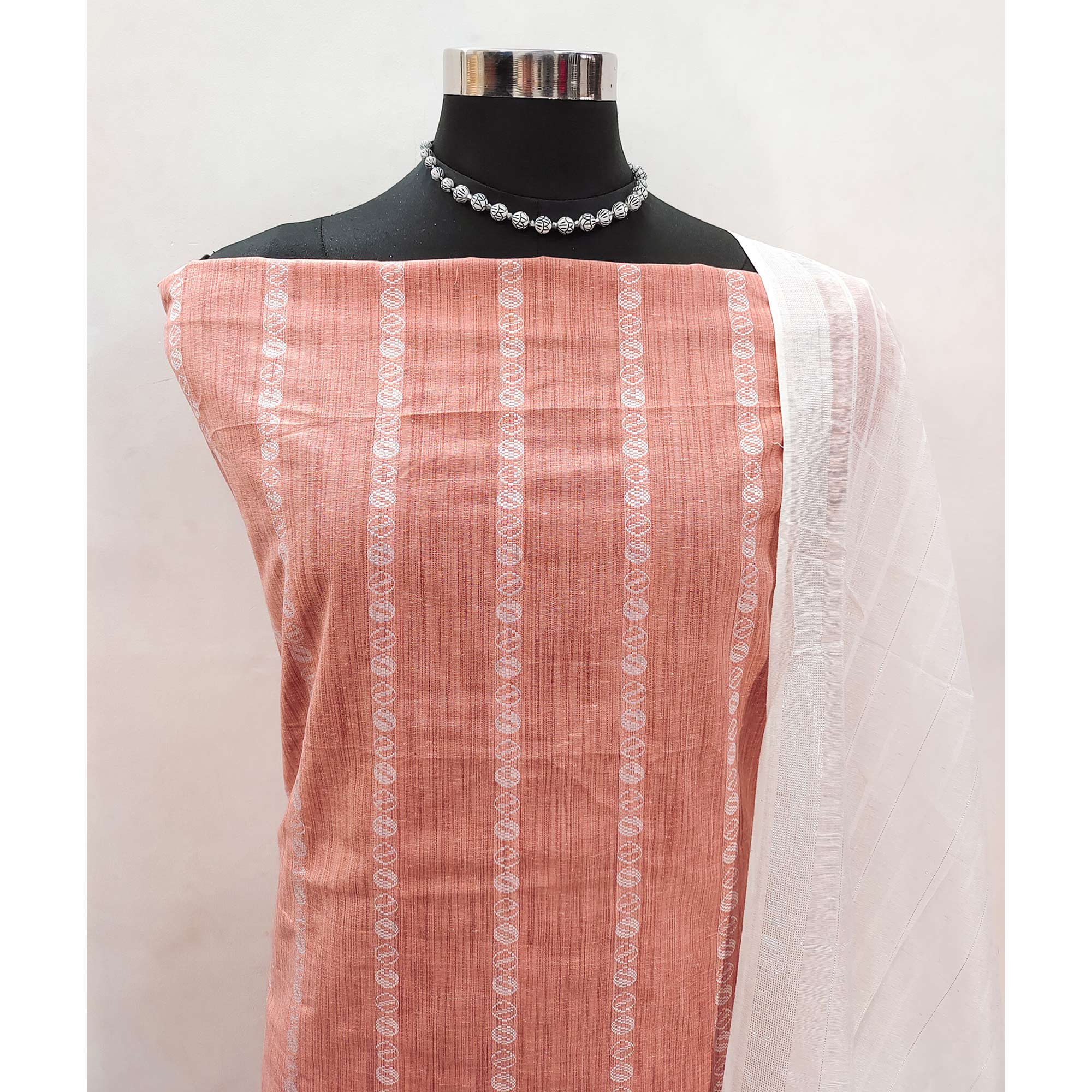 Intricate Weaving Work on Peach Pure Cotton Dress Material