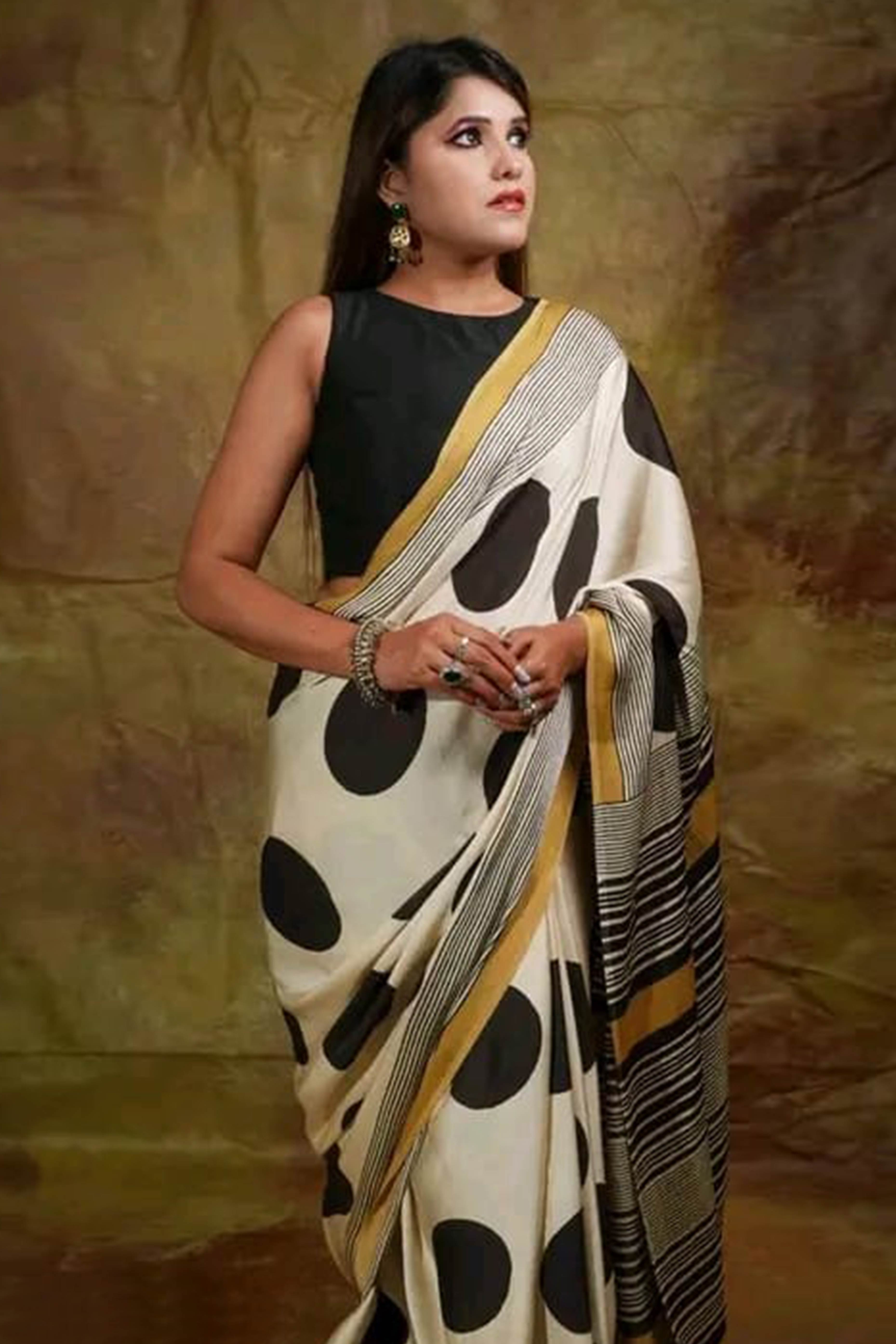 Graceful Offwhite Satin Saree Featuring Geometric & Striped Print With Tassel Pallu