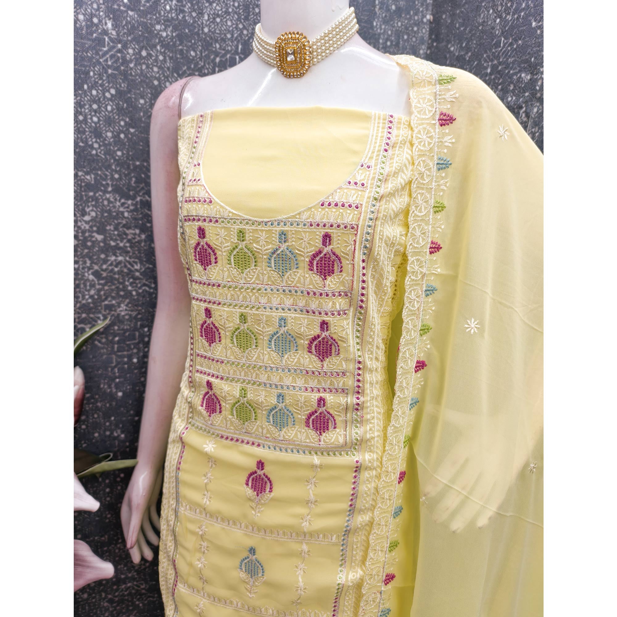Sophisticated Yellow Georgette Dress Material Accented With Ornate Floral Thread Embroidery